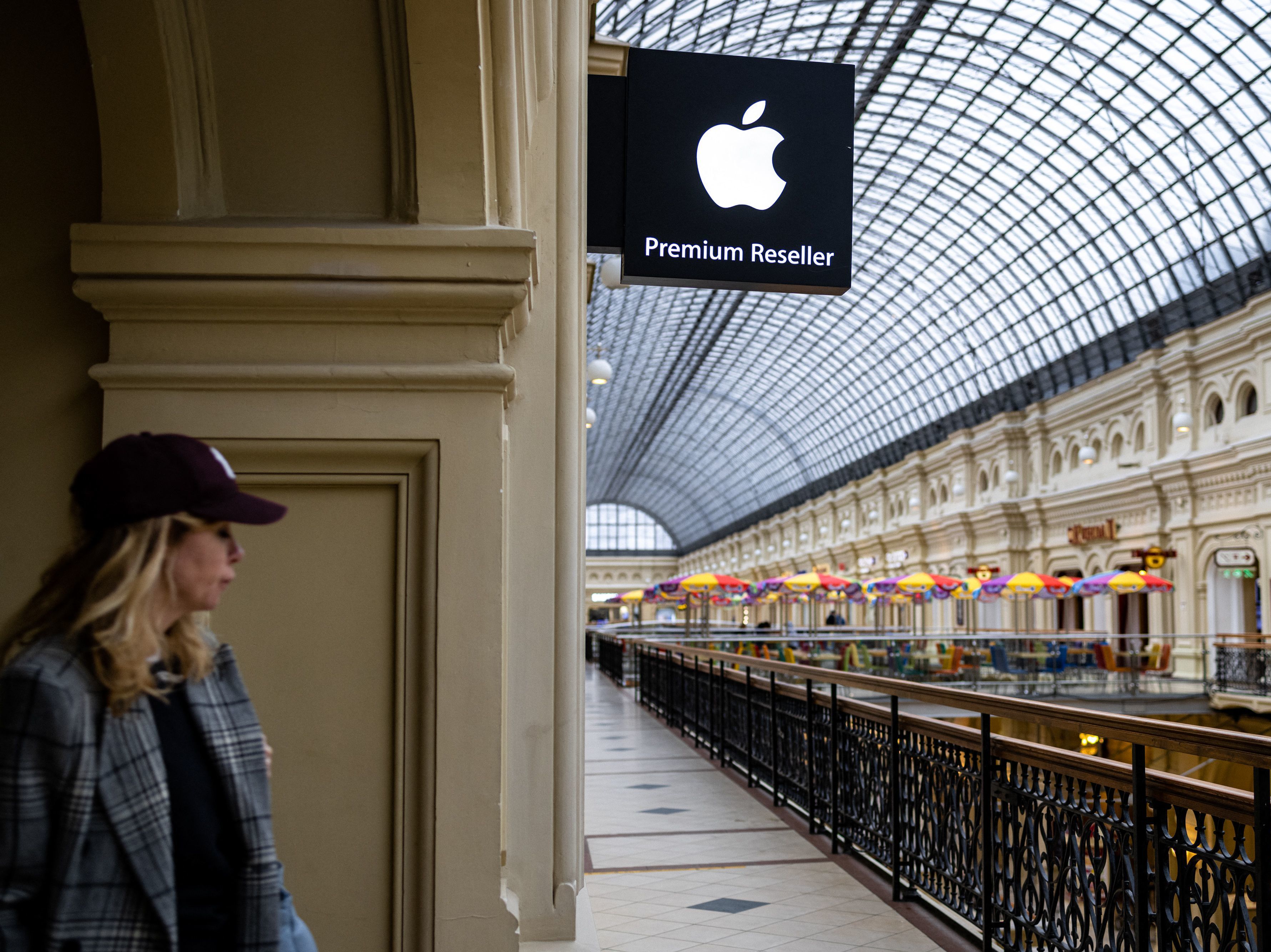 A woman passes by an Apple store at the GUM department store in central Moscow on April 27, 2021. Apple said this week that it's pausing the sale of its products in Russia. (AFP via Getty Images)