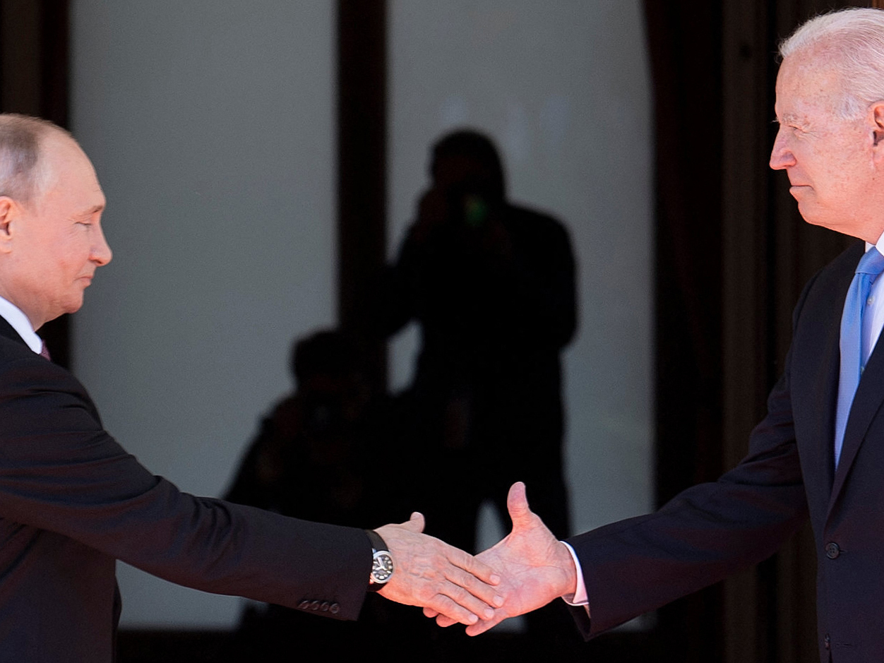 Russian President Vladimir Putin shakes hands with President Biden prior to a U.S.-Russia summit in Geneva in June. (AFP via Getty Images)