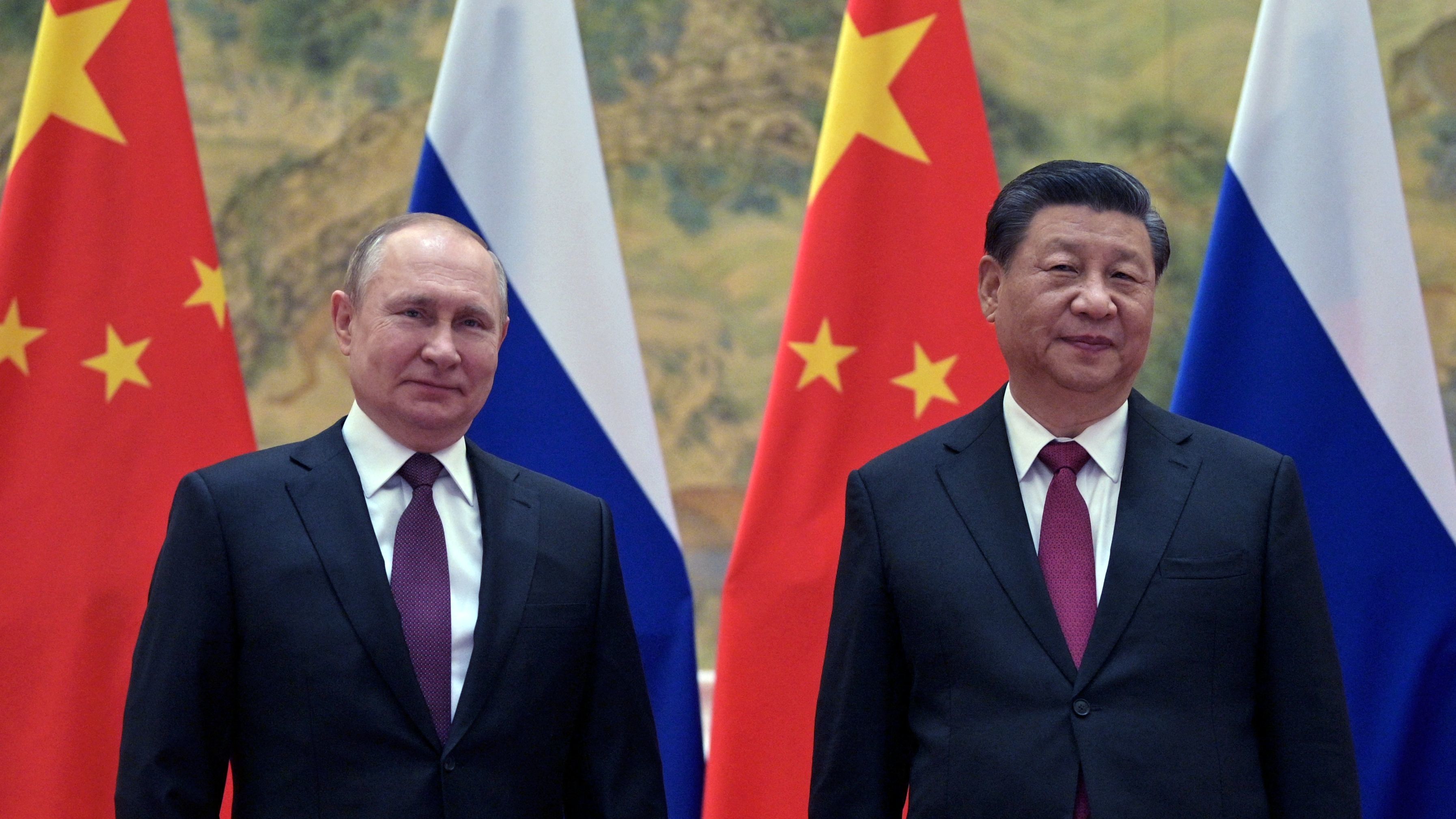 Russian President Vladimir Putin and Chinese President Xi Jinping pose during their meeting in Beijing, on Feb. 4.