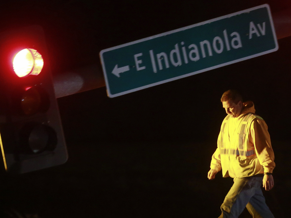 A utility worker tends to a downed stoplight on Highway 69 in Des Moines, Iowa, on Saturday, March 5, 2022, after a strong storm that hit parts of central Iowa.