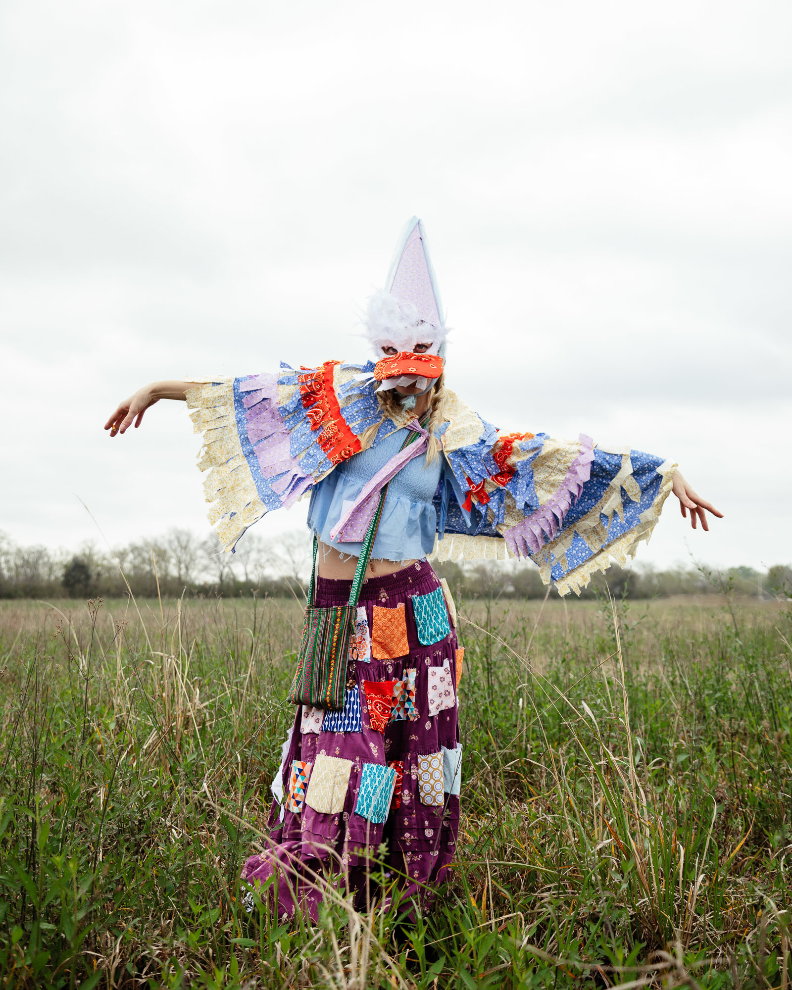 No floats or beads at this Mardi Gras, but there are chickens 2 A Mardi Gras dressed in traditional sloth scraps and handmade mask to hide their identity.