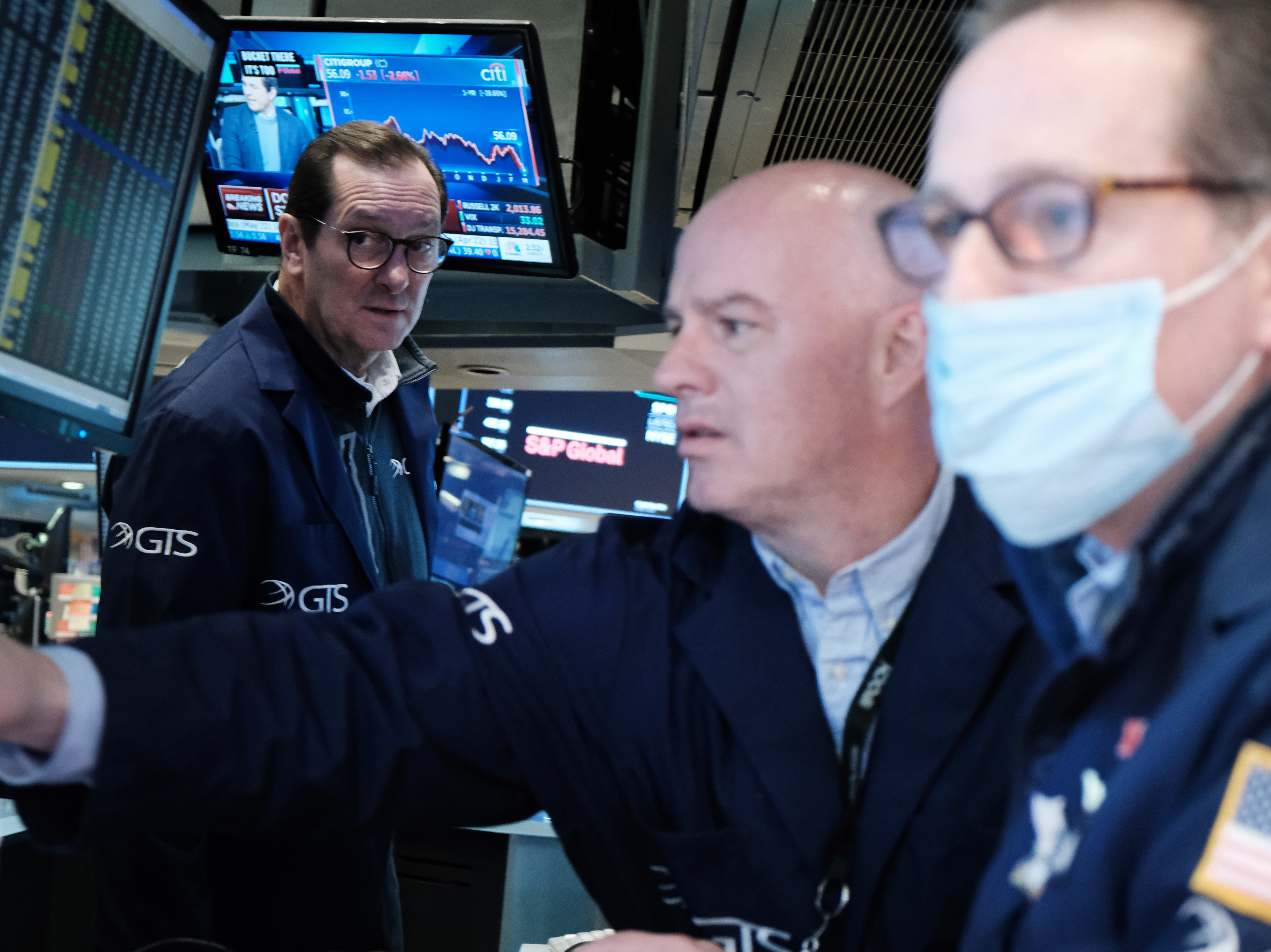 Traders work on the floor of the New York Stock Exchange in New York City on March 4. The Dow Jones Industrial Average slumped nearly 800 points on Monday, entering what's called a correction. (Getty Images)