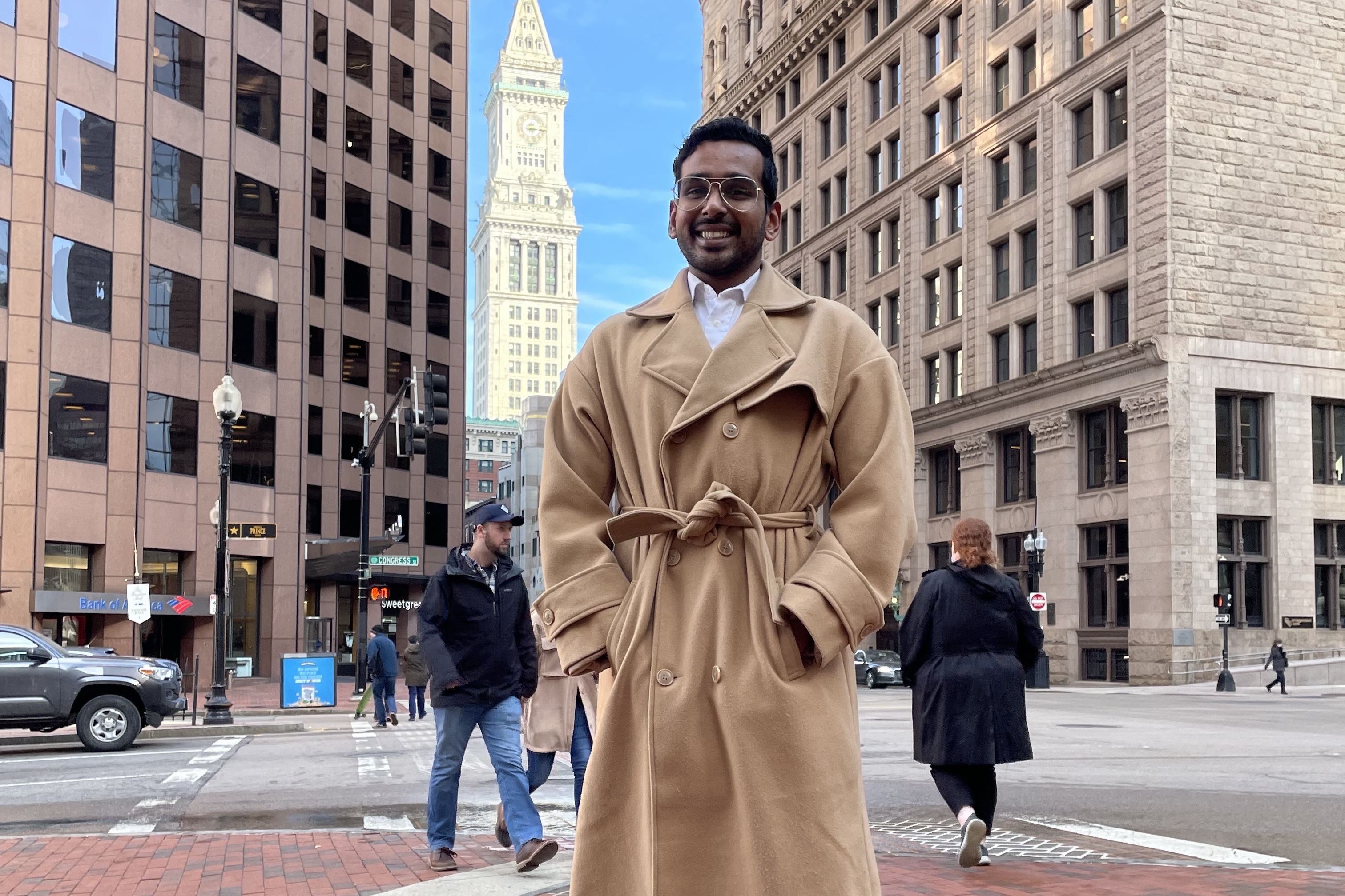 Pragadish Kalaivanan, a marketing analyst, got up extra early to dress for work before his first days back at the office in Boston. He's among those happy to still be able to work two days from home, as the company's new hybrid policy allows. (Tovia Smith/NPR)