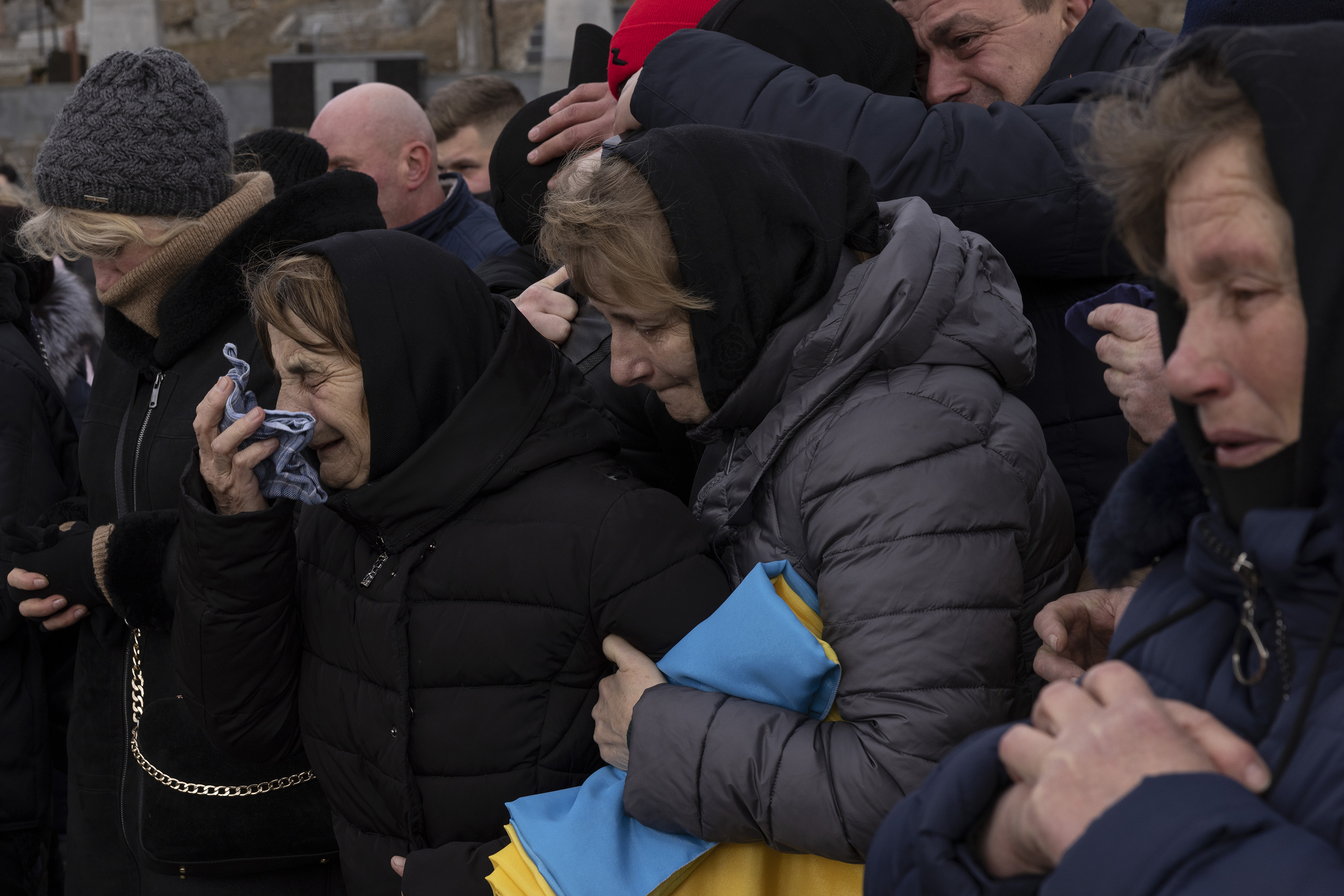 March 8: Family members grieve during a service at Lychakiv Cemetery in Lviv, Ukraine, during a joint funeral for two soldiers who died during recent fighting. The two servicemen were Victor, 44, who was killed in the Mykolaiv region, and Ivan, 25, who was killed in the Zaporizhzhia region.