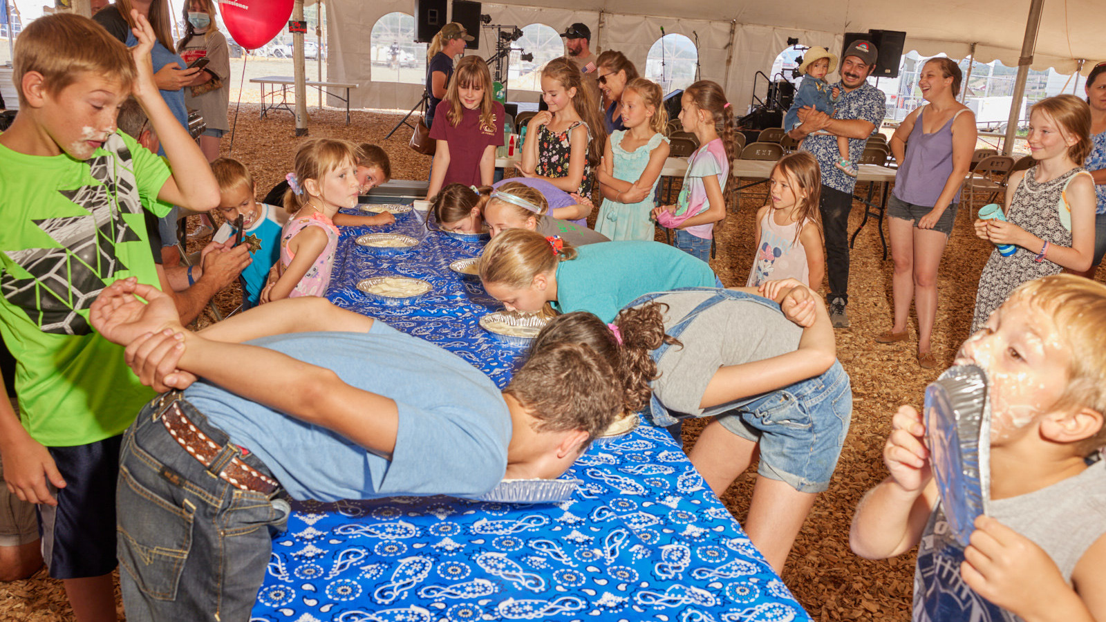 Pi Day photos of pieeating contests that reemerged after COVID