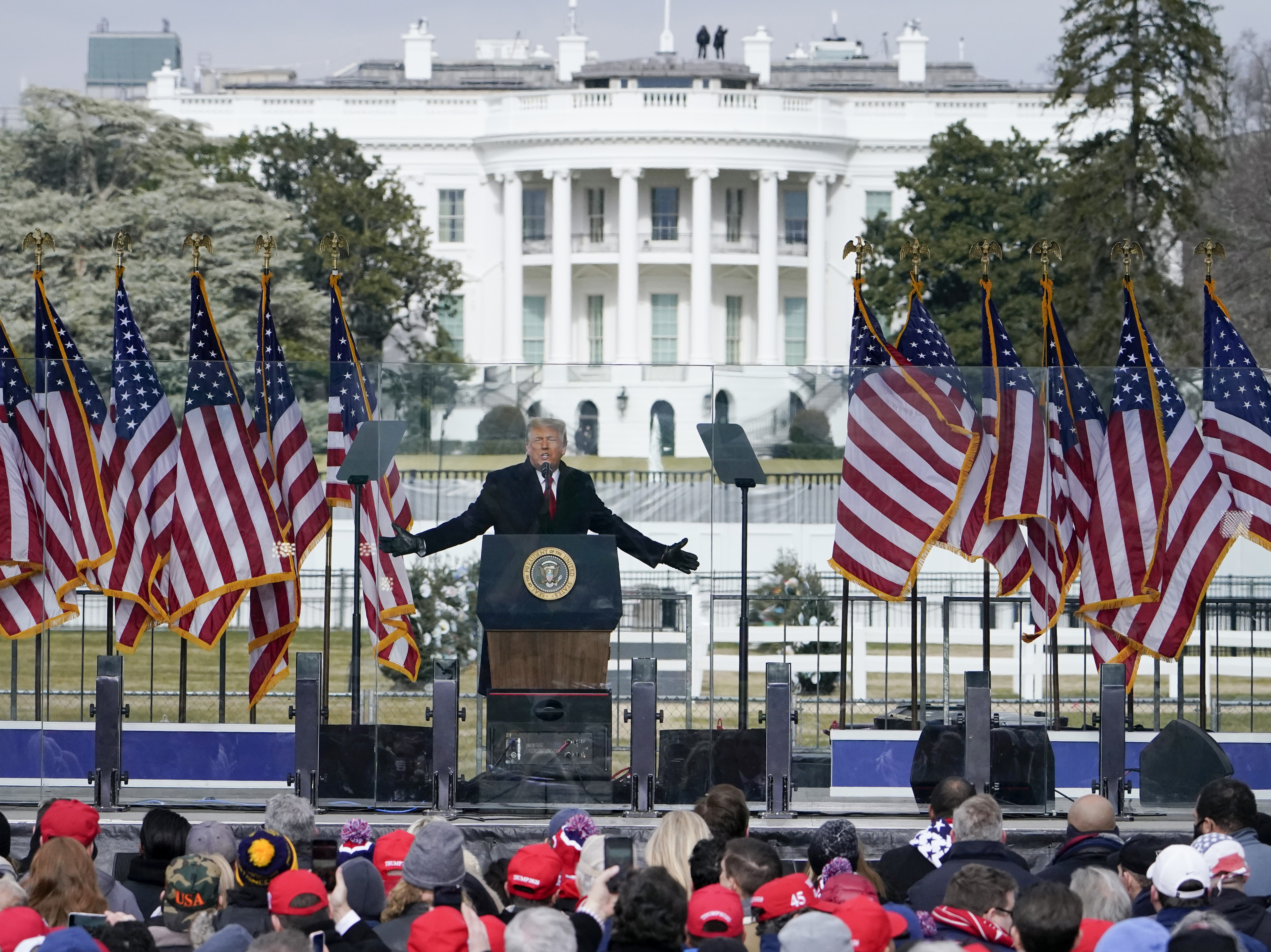 The White House in the background, President Donald Trump speaks at a rally in Washington, Jan. 6, 2021. The House committee investigating the attack on the U.S. Capitol is probing the funding for the rally and other events that preceded the deadly attack on Capitol Hill.