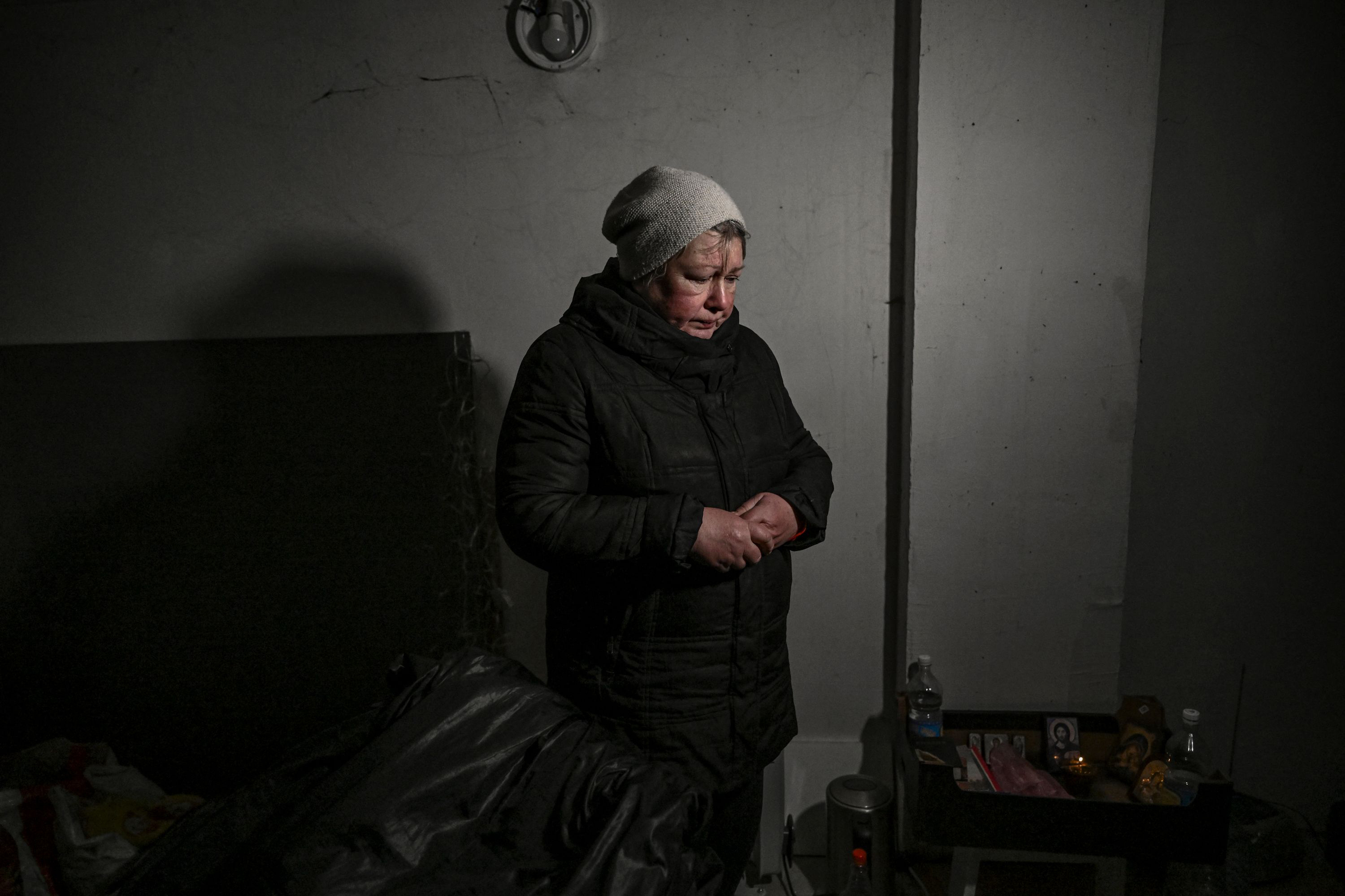 March 10: A resident stands in a basement for shelter in Irpin.