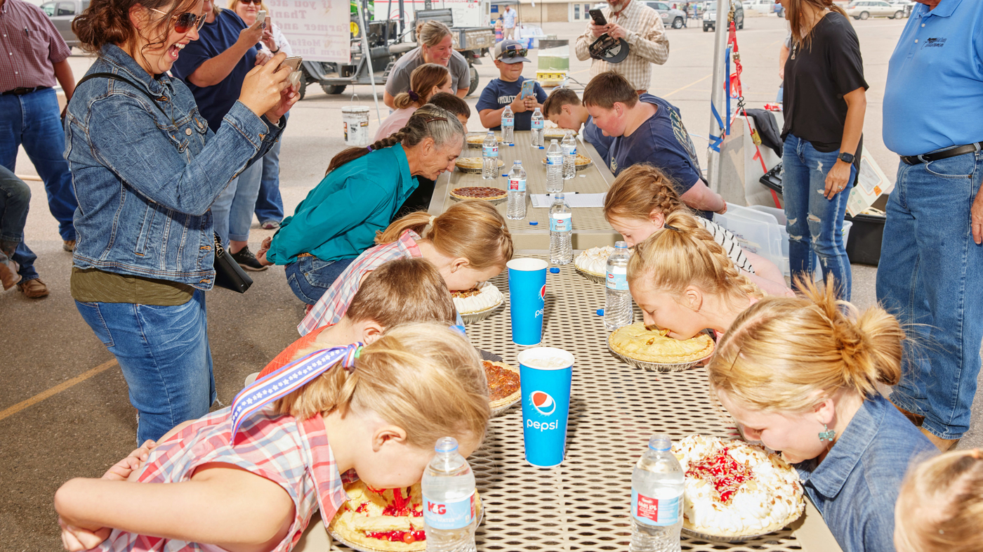 Pi Day photos of pieeating contests that reemerged after COVID