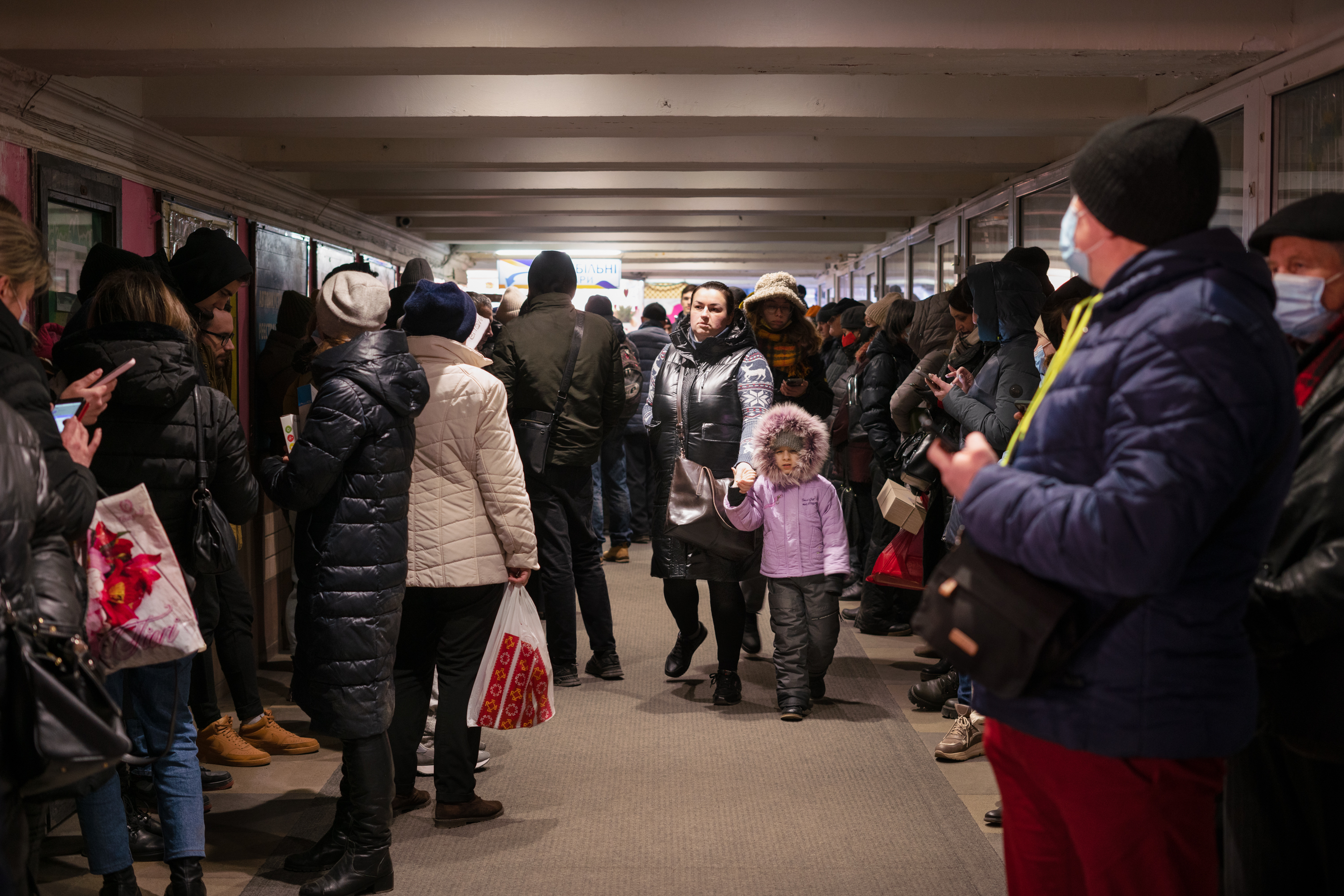 March 11: People enter and leave an underground walkway during an air-raid siren in Lviv, Ukraine.