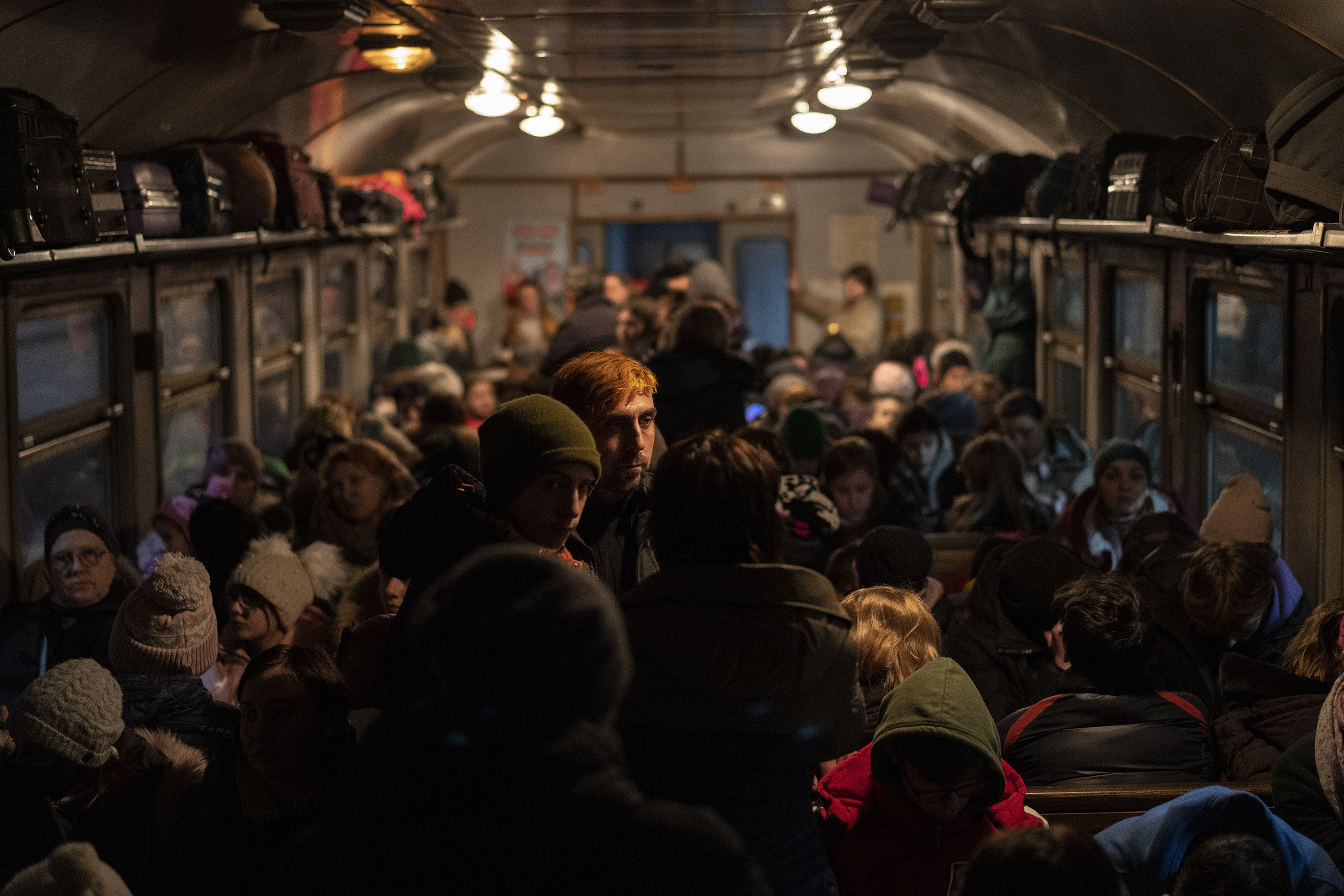March 13: Displaced Ukrainians board a train bound for Poland in Lviv, Ukraine, which has largely been spared the kind of destruction seen to the south and east.