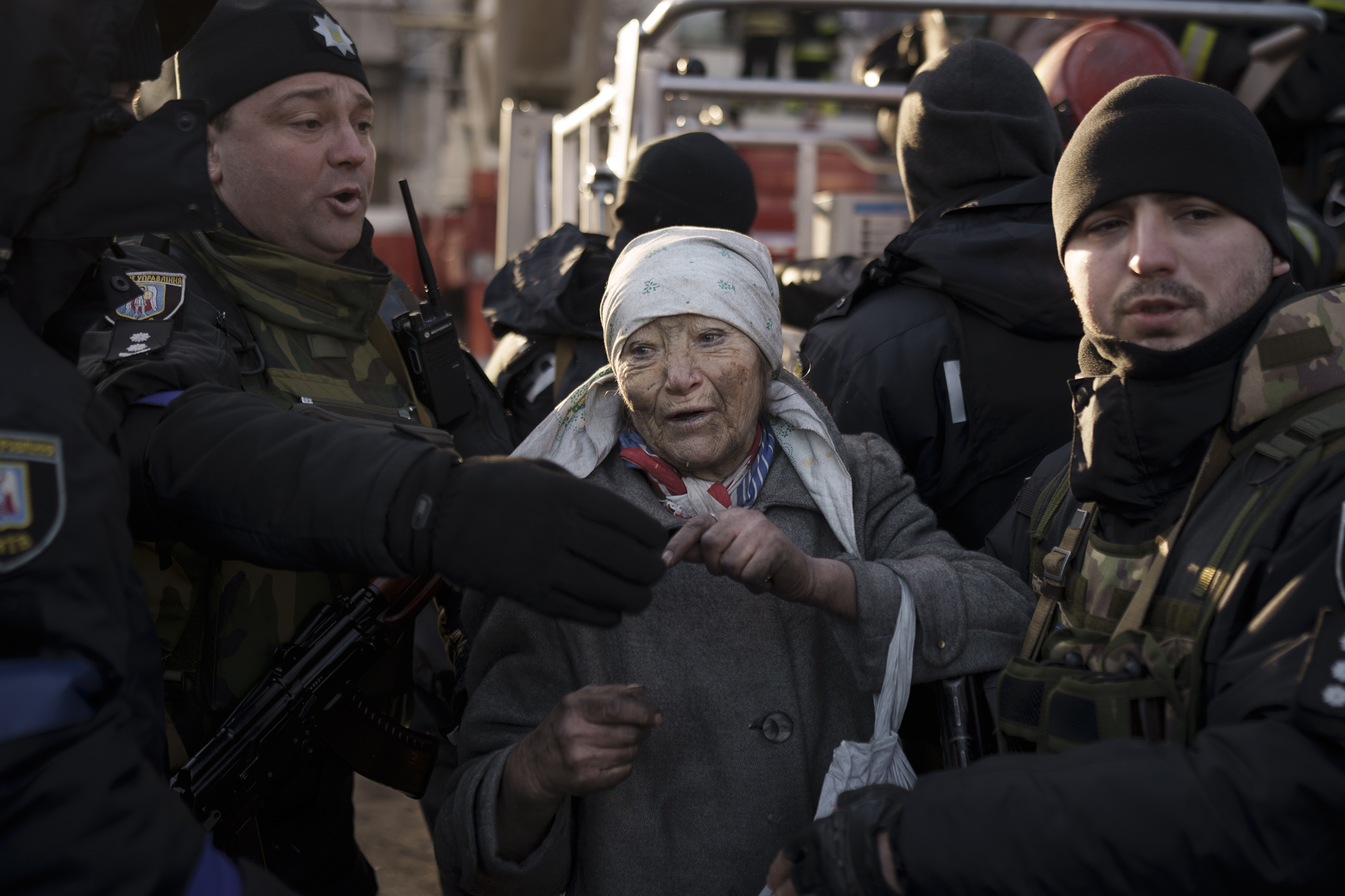 March 15: An elderly woman is helped by police officers after she was rescued by firefighters from inside her apartment after bombing in Kyiv, Ukraine. Russia's offensive in Ukraine has edged closer to central Kyiv, with a series of strikes hitting a residential neighborhood as the leaders of three European Union-member countries planned a visit to the embattled capital Tuesday.
