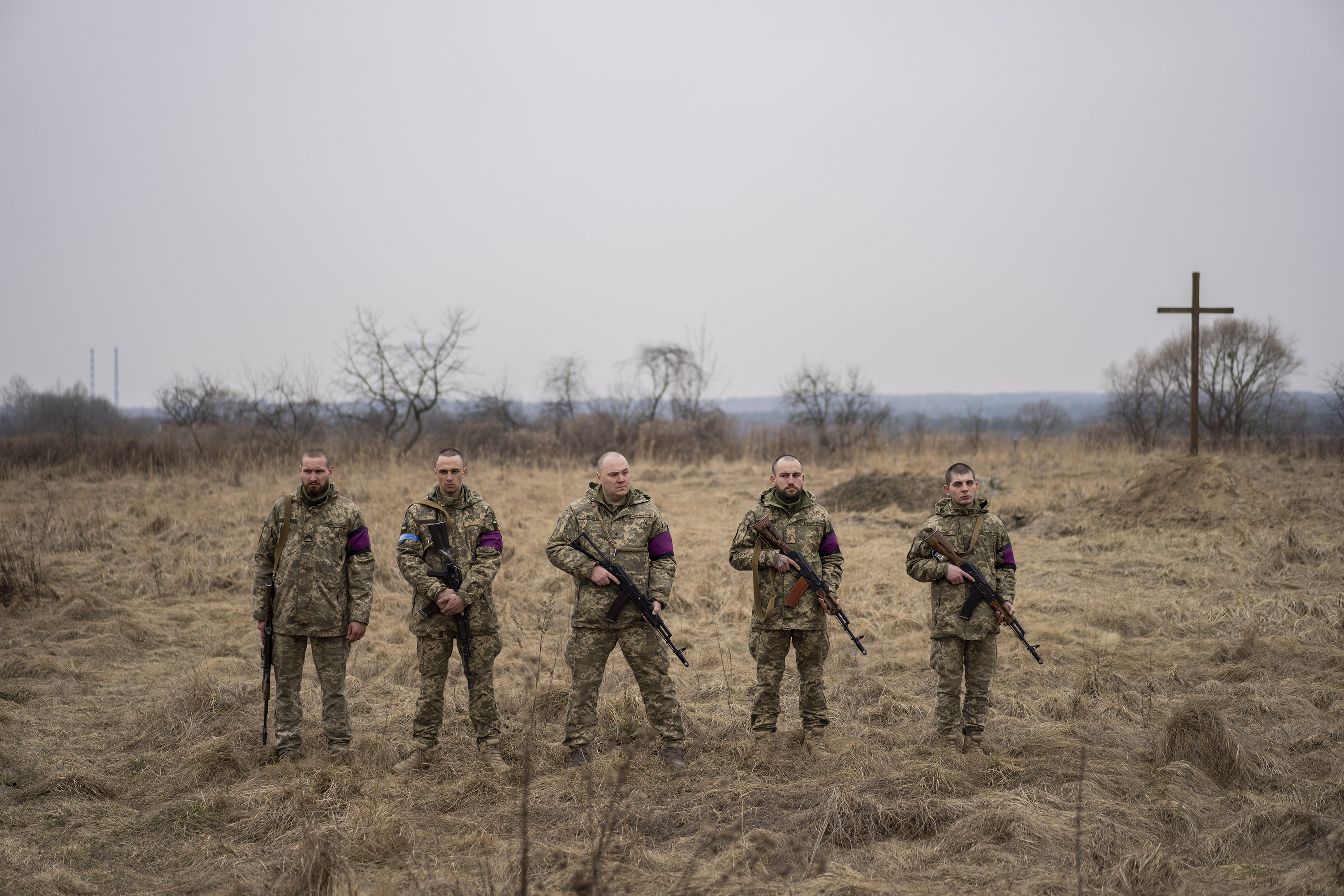 March 16: Ukrainian servicemen prepare to fire salutes during the funeral of their comrades, Roman Rak and Mykola Mykytiuk, in Starychi, Ukraine. Rak and Mykytiu were killed during Russia's missile strike Sunday on a military training base in Yavoriv.