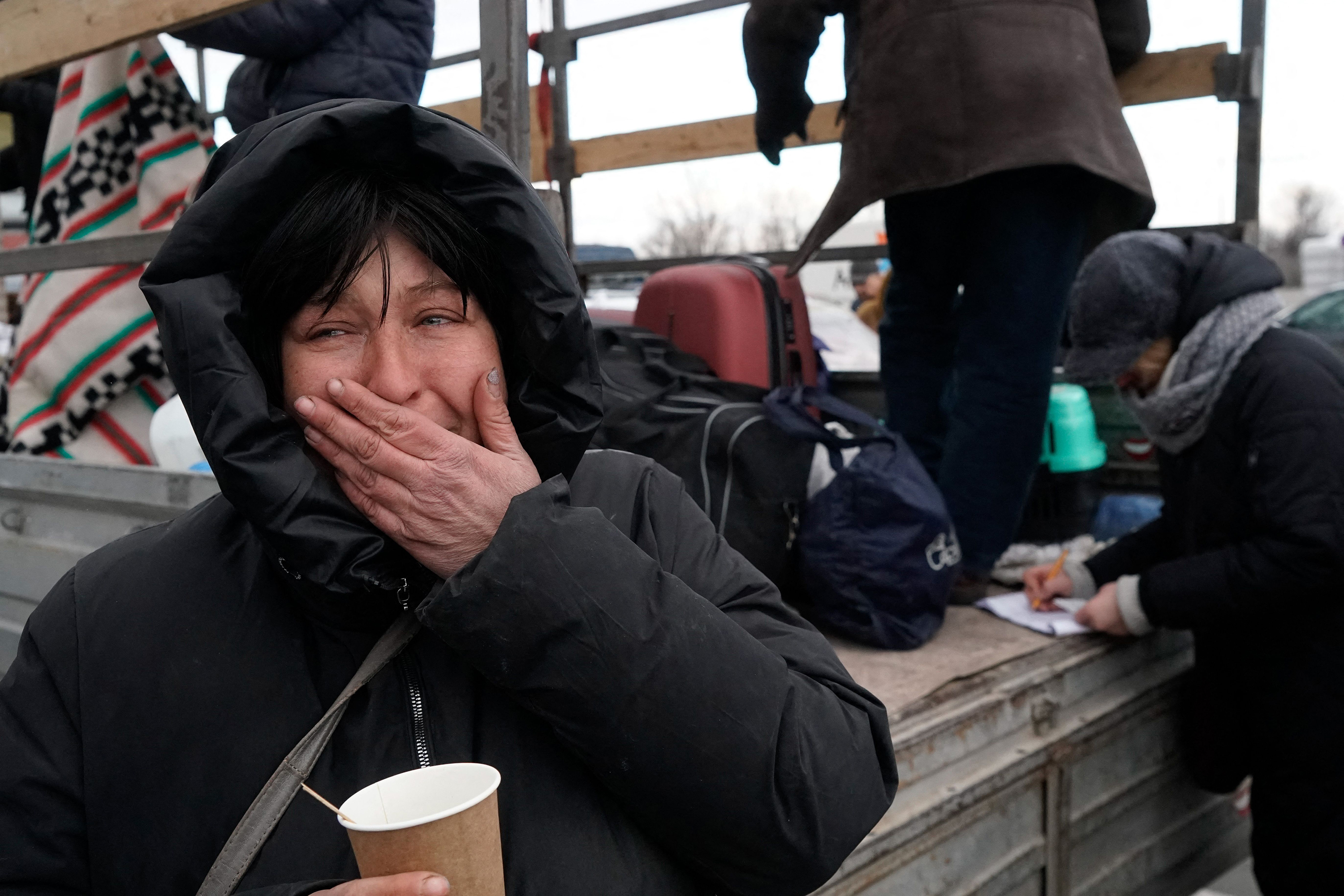 March 16: Evacuees from Mariupol are seen upon arrival at the car park of a shopping center on the outskirts of the city of Zaporizhzhia, which is now a registration center for displaced people.