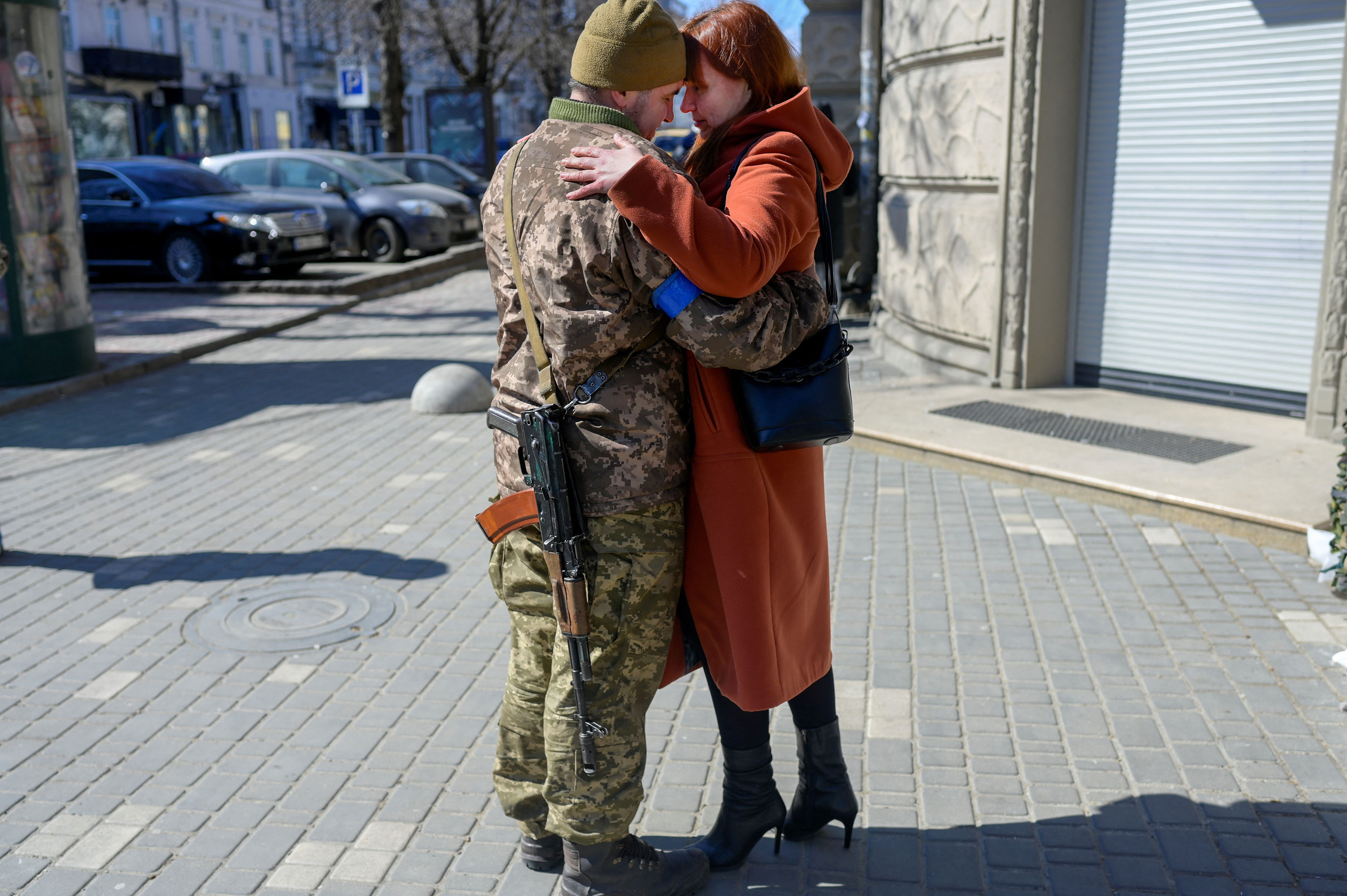 March 17: Igor, a 40-year-old Ukrainian soldier, embraces his wife in Odessa.