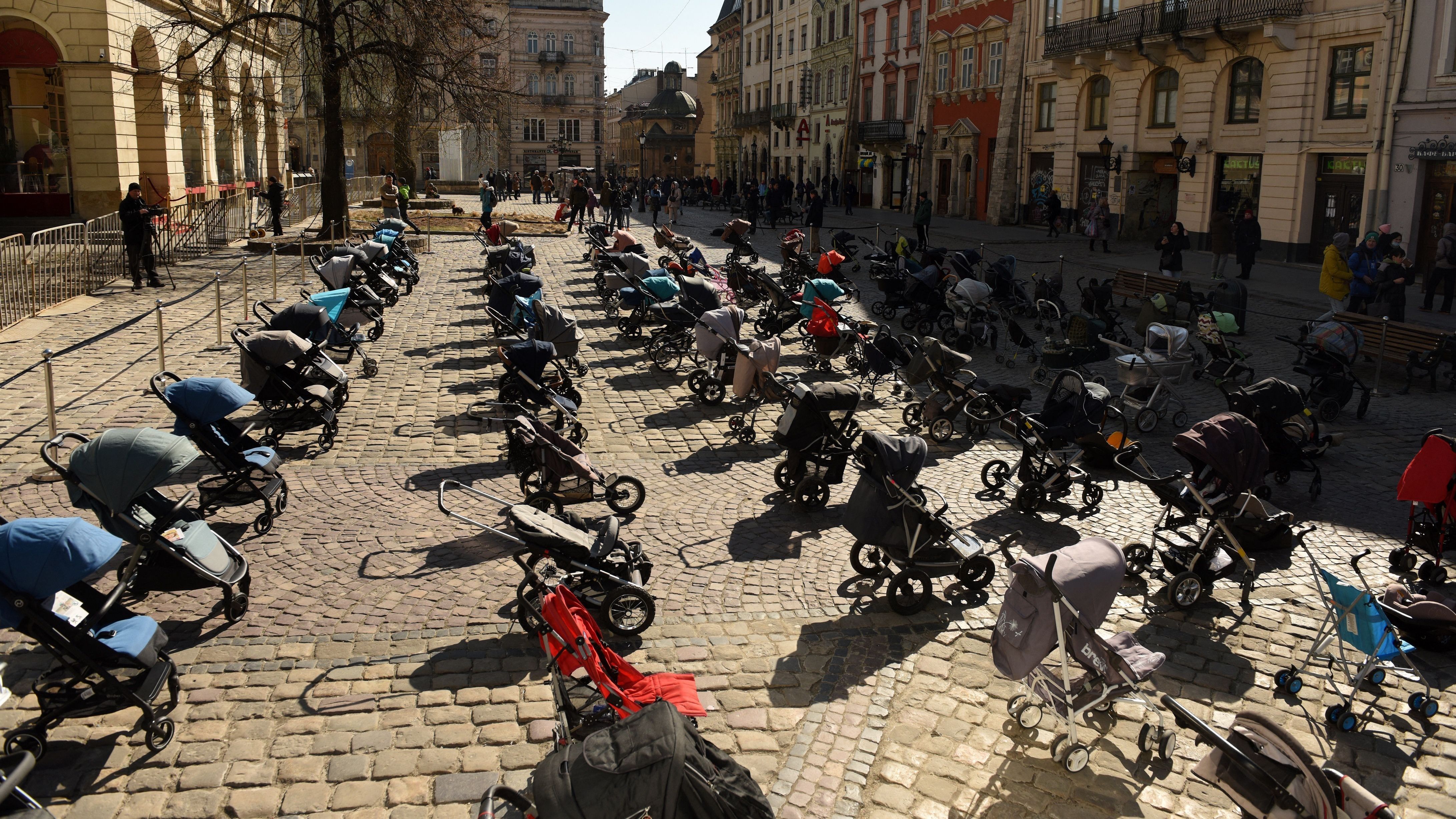 In a picture taken on Friday, 109 empty strollers are seen arrayed outside the Lviv City Council, highlighting the number of children killed in the ongoing Russian invasion of Ukraine. (AFP via Getty Images)