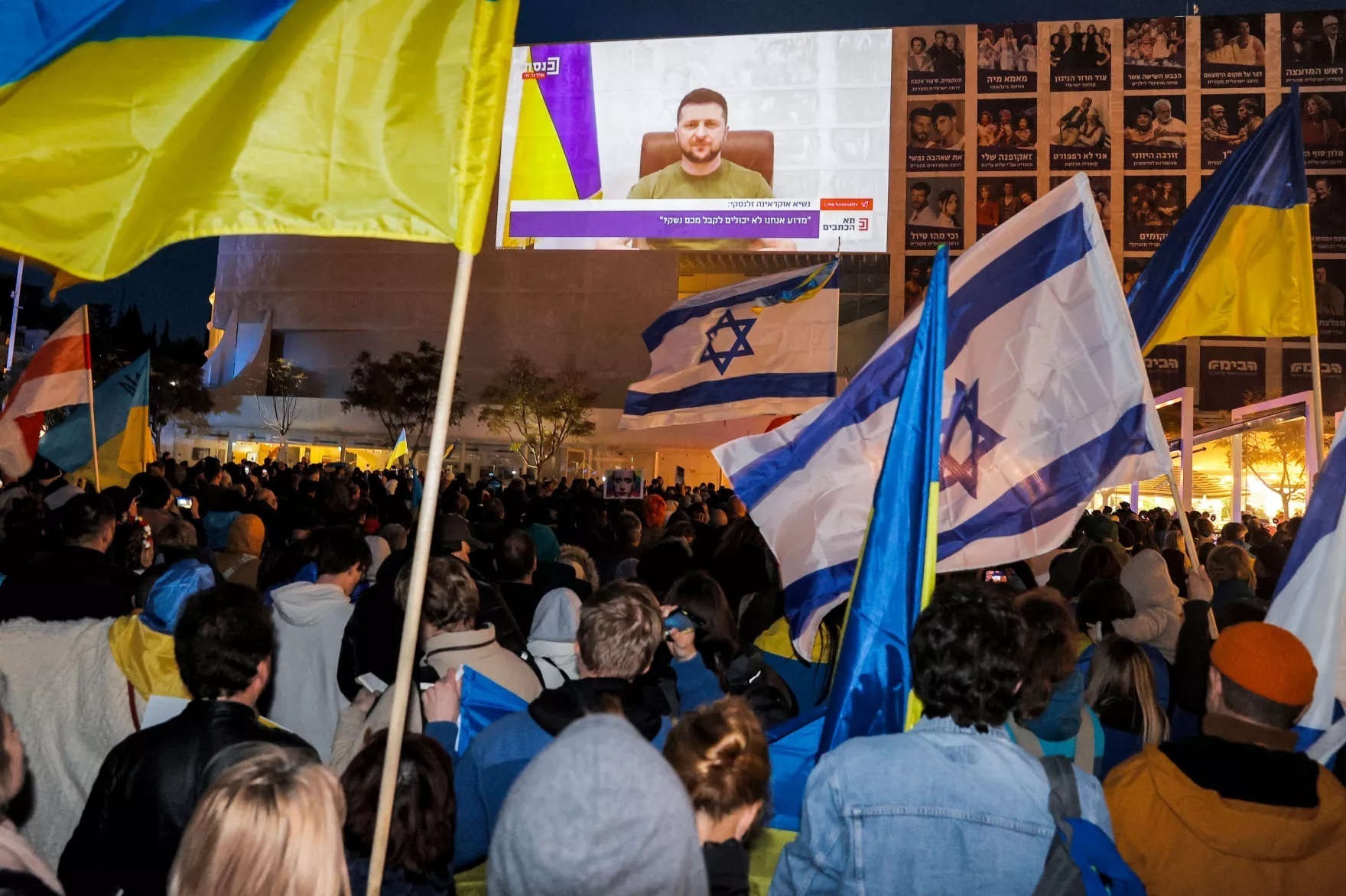 Demonstrators gather at Habima Square in Tel Aviv on Sunday to attend a televised video address by Ukraine's President Volodymyr Zelenskyy. (AFP Via Getty Images)
