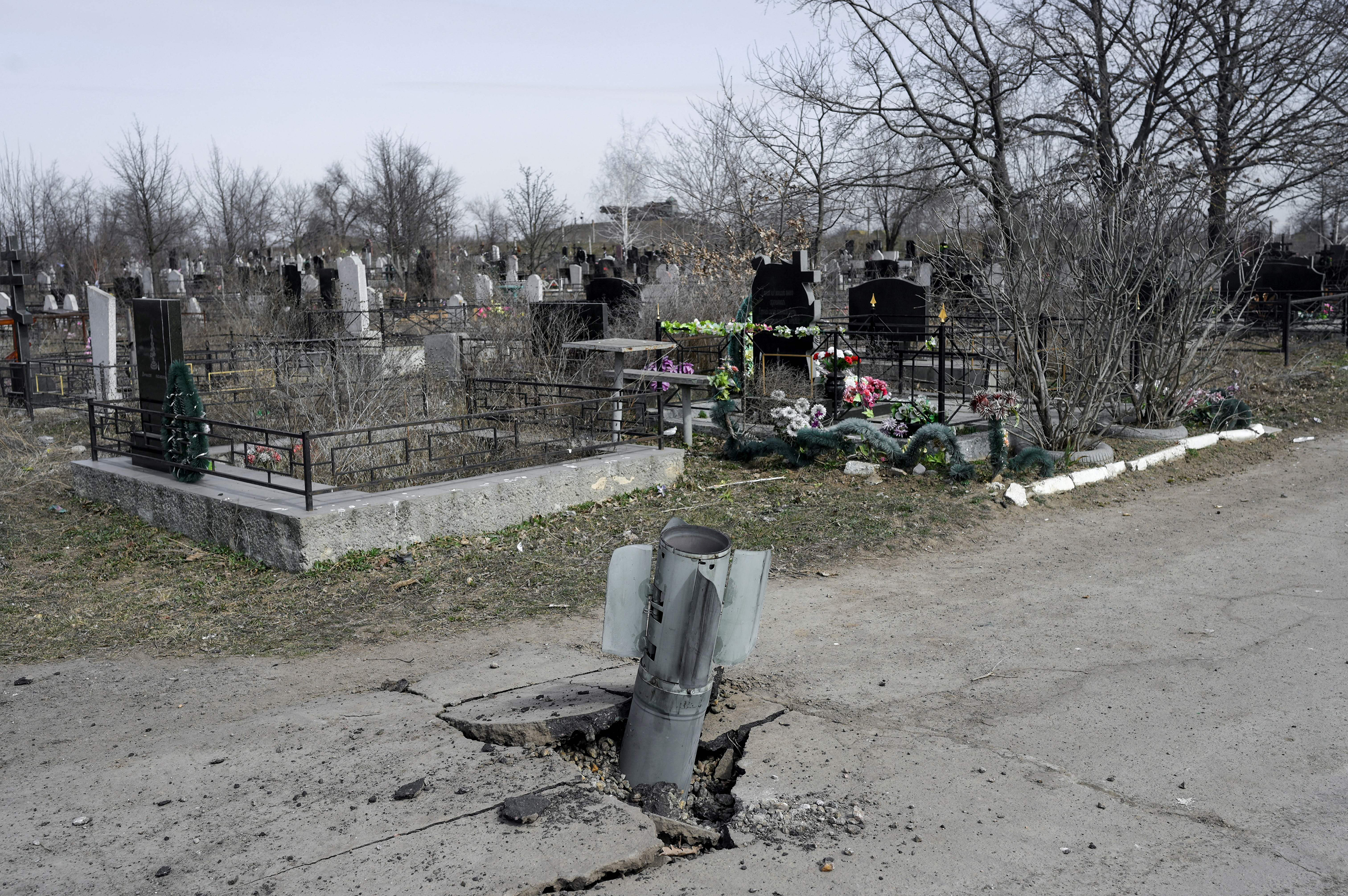 March 21: An unexploded rocket sits wedged in a cemetery road in Mykolaiv, in southern Ukraine.