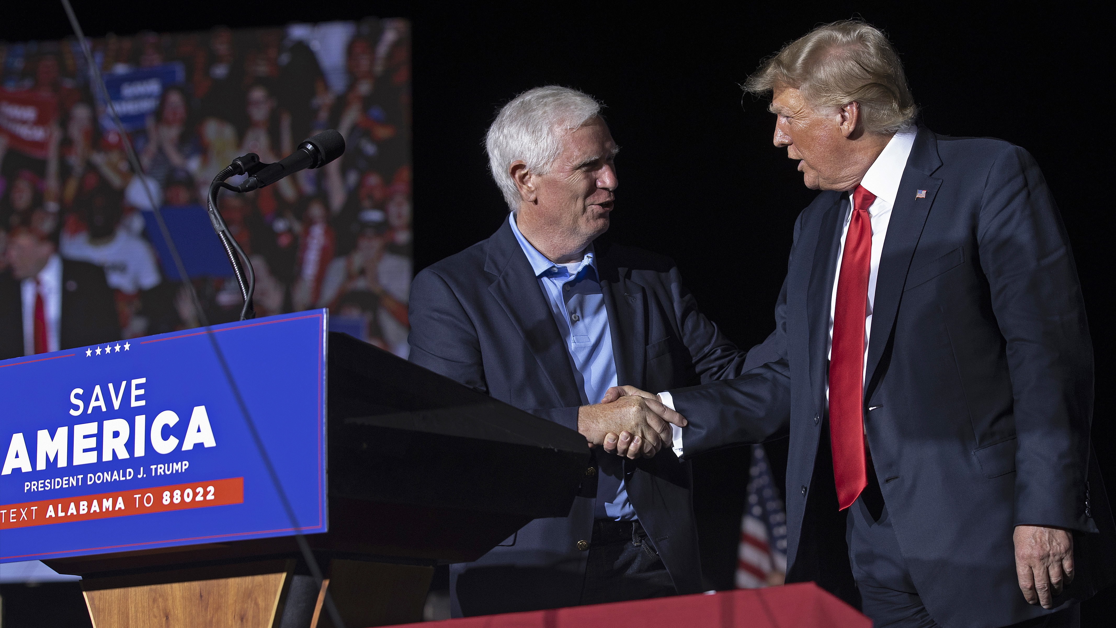 Former President Donald Trump welcomes Rep. Mo Brooks, R-Ala., a candidate for U.S. Senate, to the stage during a rally in Cullman, Ala., on Aug. 21, 2021. Trump on Wednesday pulled his endorsement of Brooks, who's been struggling in polls. (Getty Images)