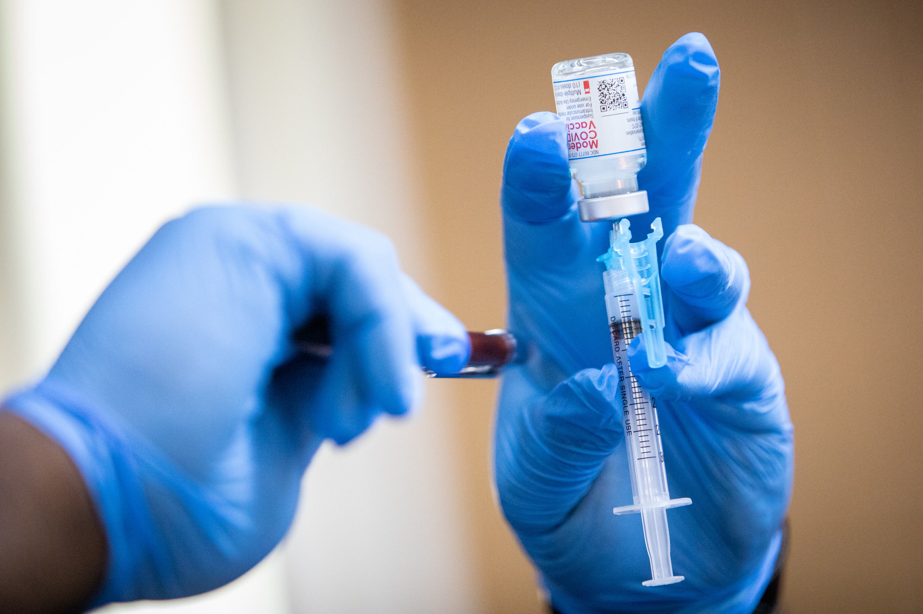 A Moderna COVID-19 vaccine is prepared during a pop-up vaccine clinic at Cristo Rey Church in East Austin on July 24, 2021. (KUT)