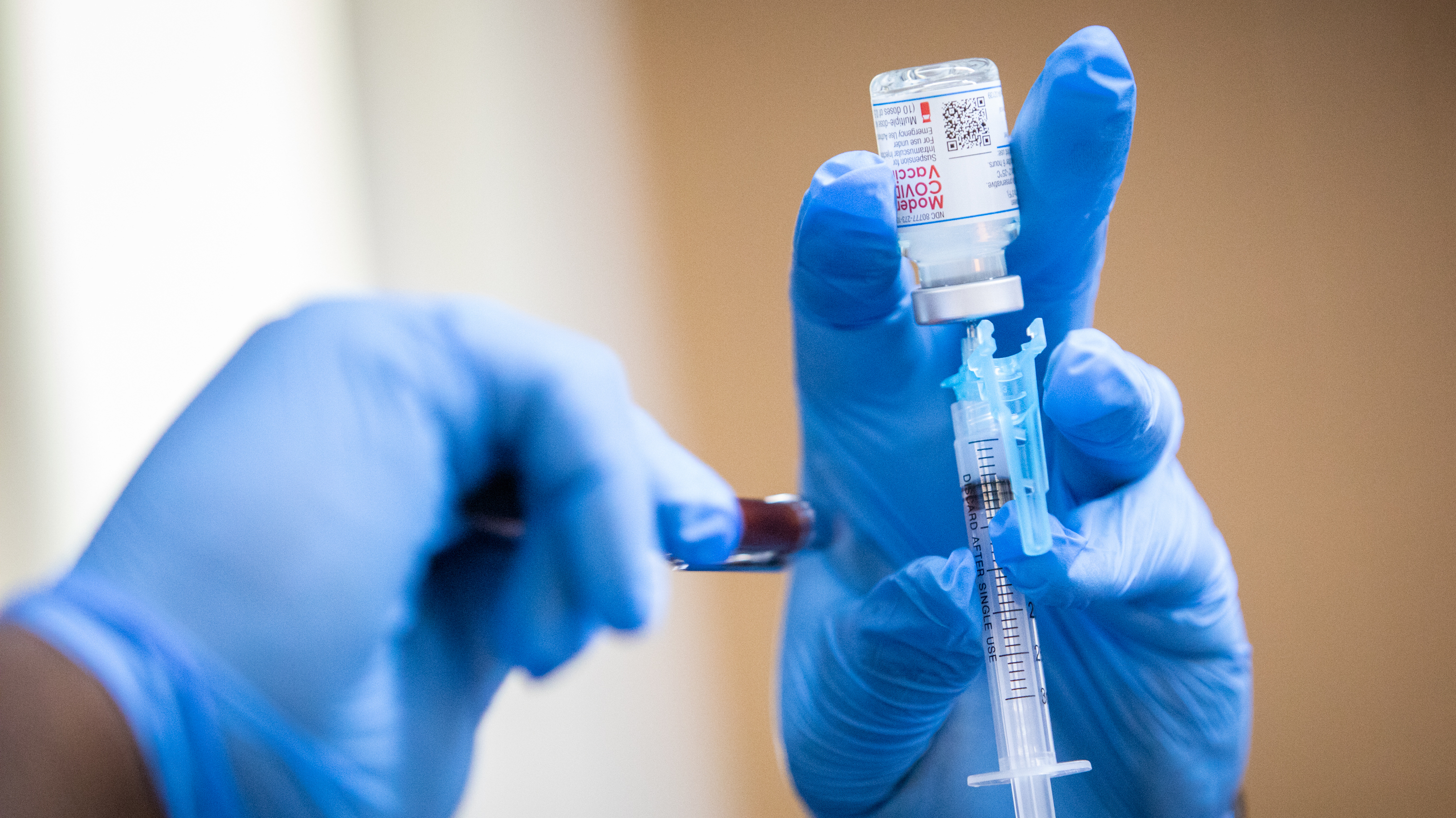 A Moderna COVID-19 vaccine is prepared during a pop-up vaccine clinic at Cristo Rey Church in East Austin on July 24, 2021.