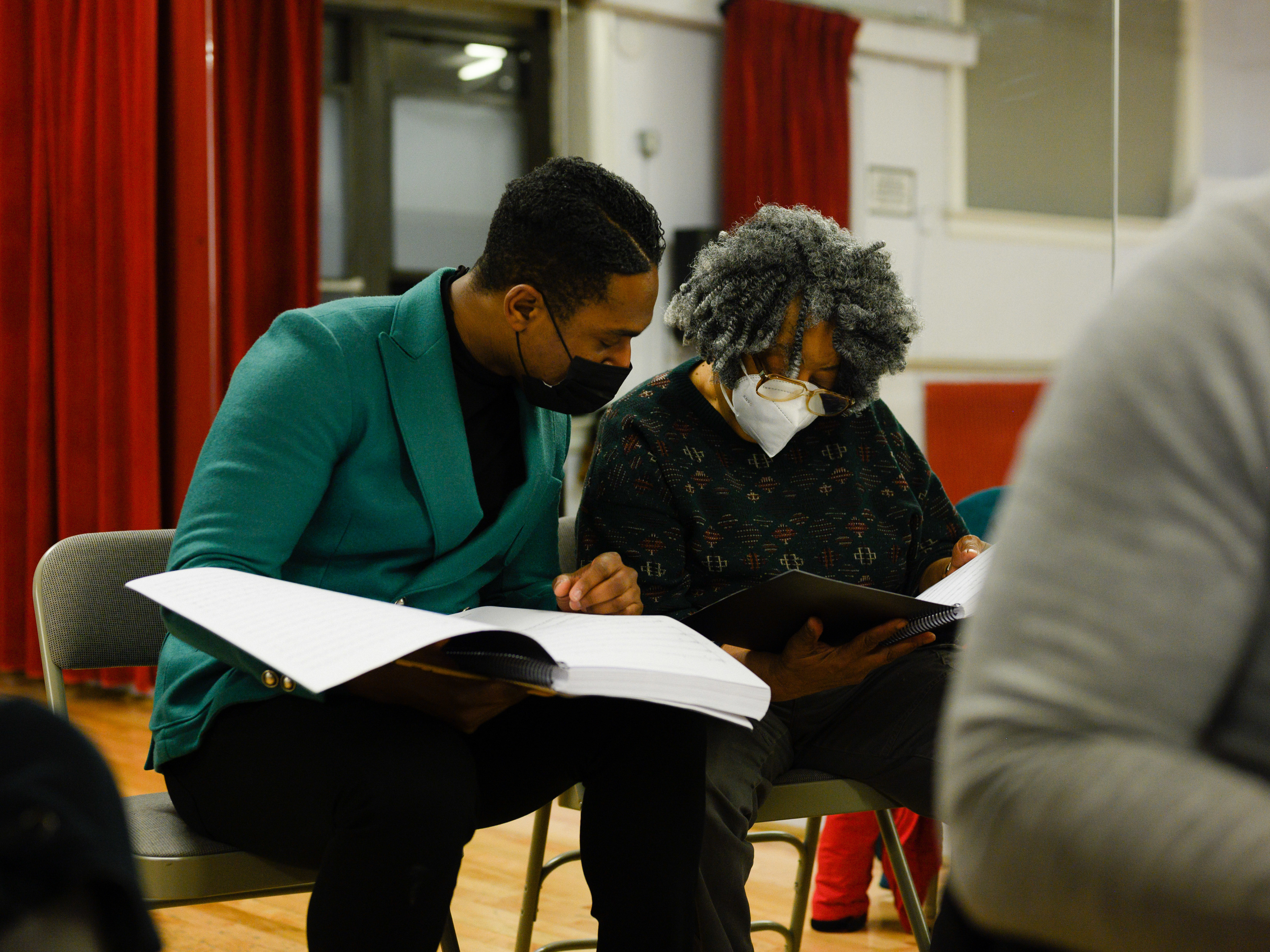 Chorus director Malcolm J. Merriweather, left, and composer Mary D. Watkins, right, review the chorus music for Emmett Till, A New American Opera at Ripley-Grier Rehearsals in New York, NY on March 17, 2022.