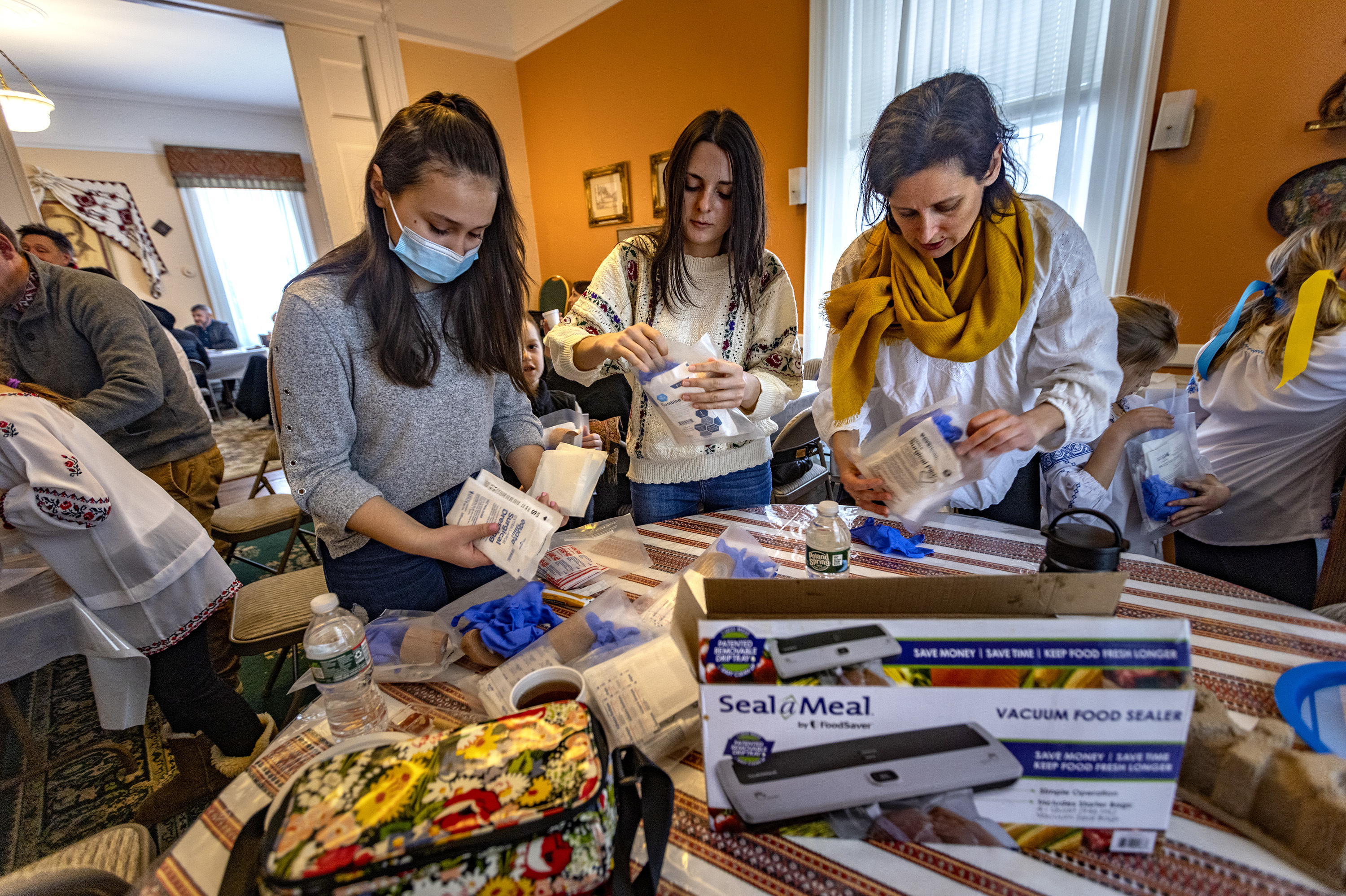 March 6: Renata Konrad and other volunteers from Plast, the Ukrainian Scout Organization, fill plastic bags with medical supplies that will be distributed to Ukrainians on the ground who need them at the Christ the King Ukrainian Catholic Church in Jamaica Plain, a neighborhood in Boston, Massachusetts.