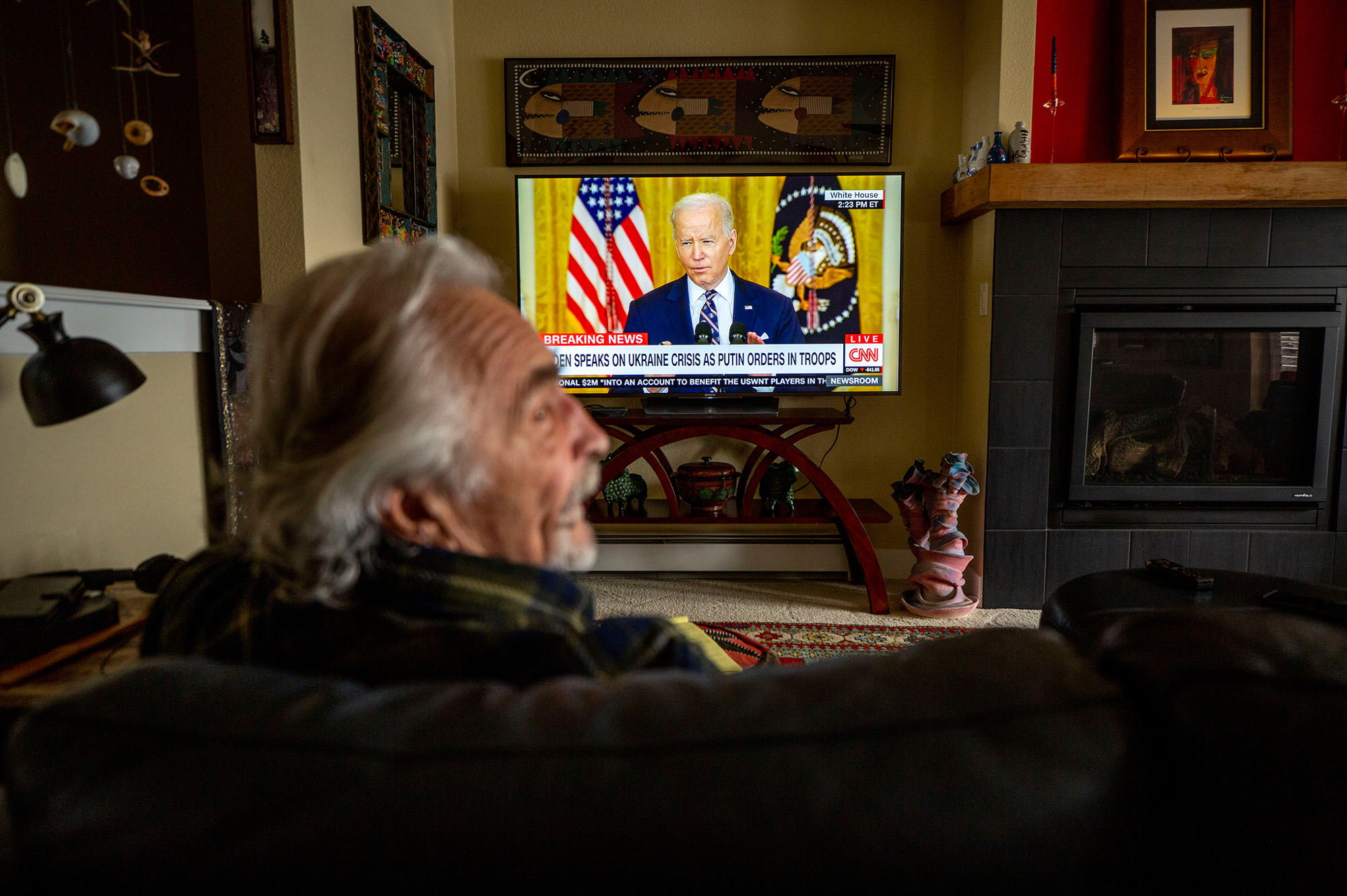 Feb. 22: Hlib Hayuk watches a speech on Russia by President Biden from his Lakewood, Denver, home.