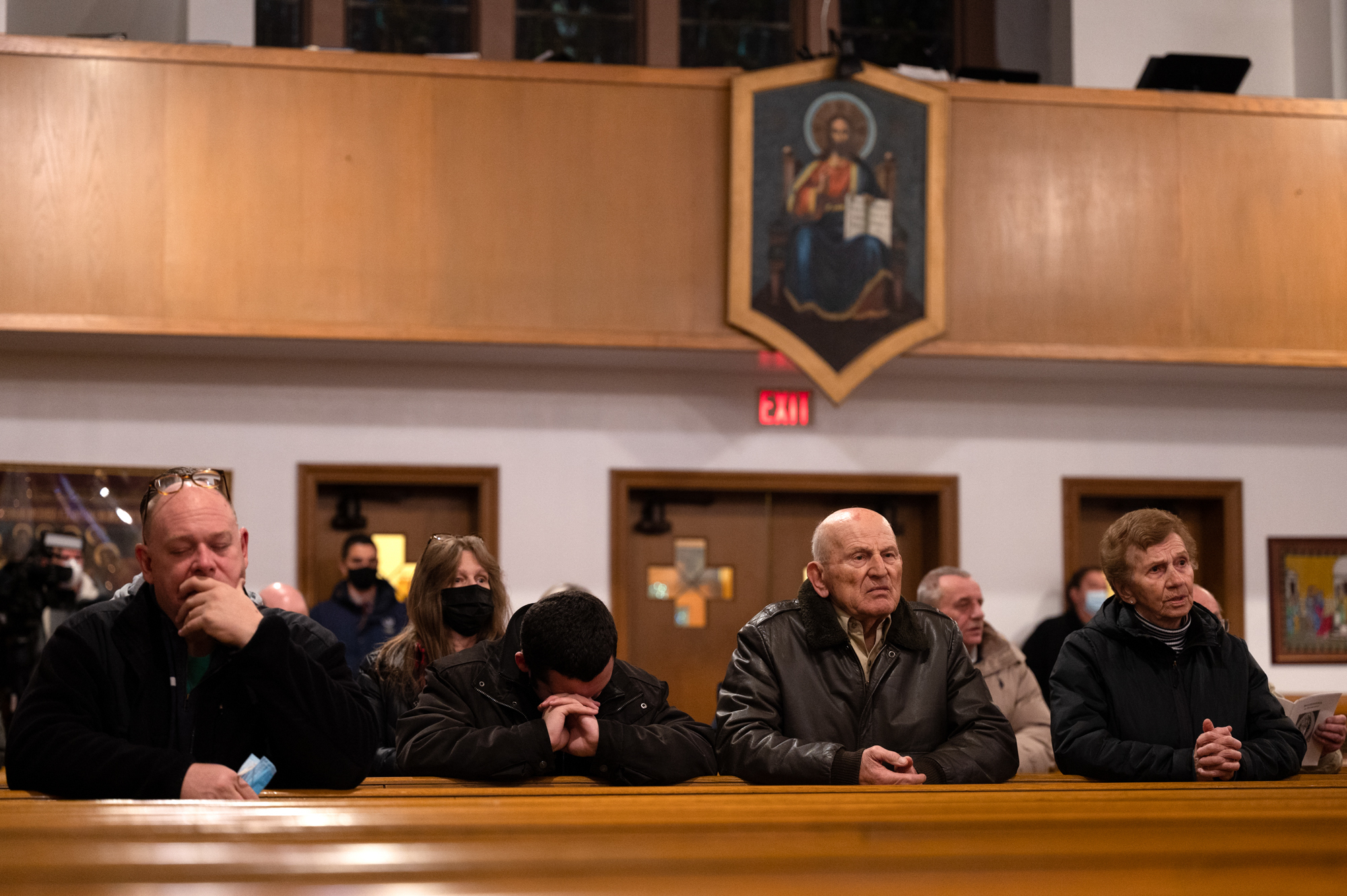 Feb. 24: Ukrainian Americans and congregants of St. Michael the Archangel Ukrainian Catholic Church in New Haven, Connecticut, pray during a service held in support of Ukraine at the outset of Russia's invasion.