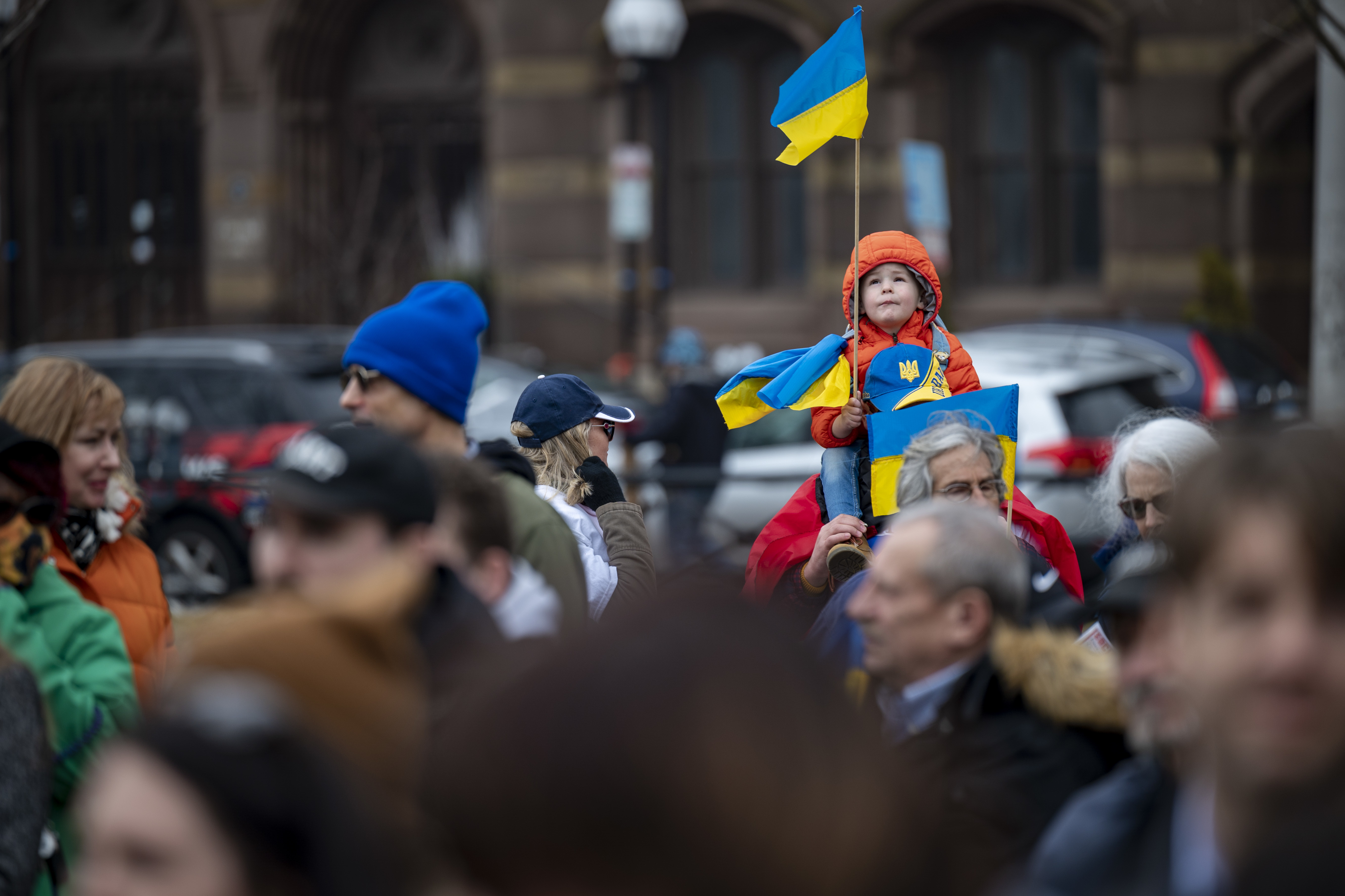 March 6: Maksym Levus, age 3, perches above a crowd of Ukrainian Americans at a rally in support of Ukraine in New Haven, Connecticut.