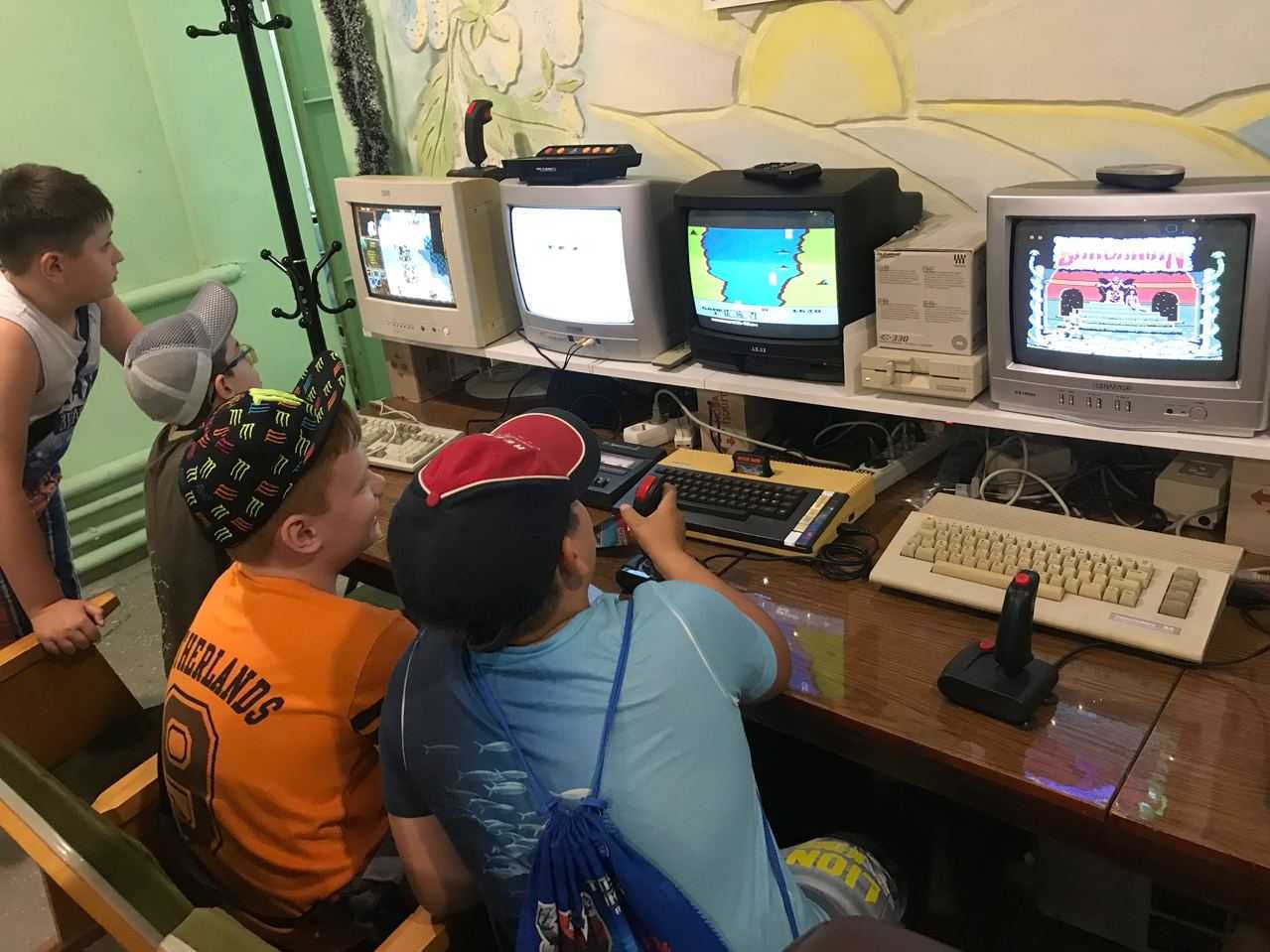 Kids play on retro computers in the IT 8-bit museum in Mariupol, Ukraine, before it was attacked. (Dmitriy Cherepanov)