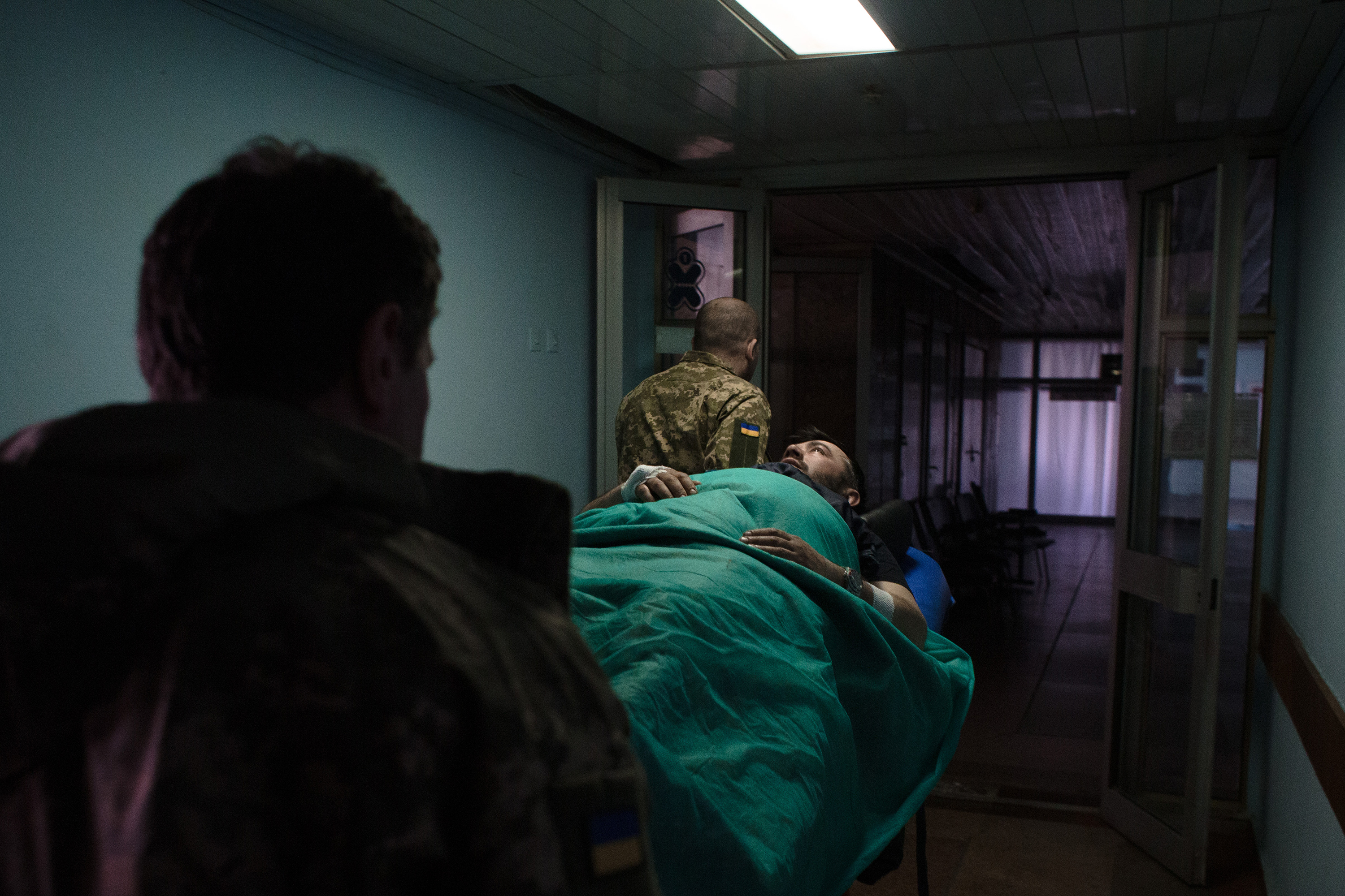 March 24: Paramedics transfer a wounded Ukrainian serviceman, Rostyslav, aged 42, in a hospital in Kyiv, Ukraine.