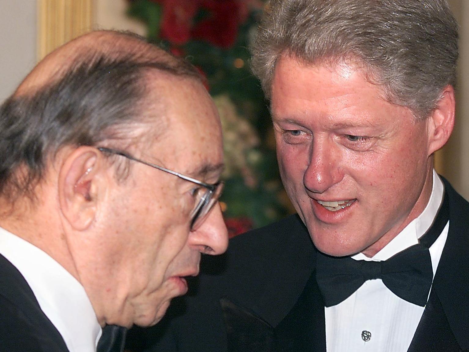 Then-President Bill Clinton talks with then-Fed Chair Greenspan during the receiving line at the White House in Washington, D.C., on Dec. 31, 1999.