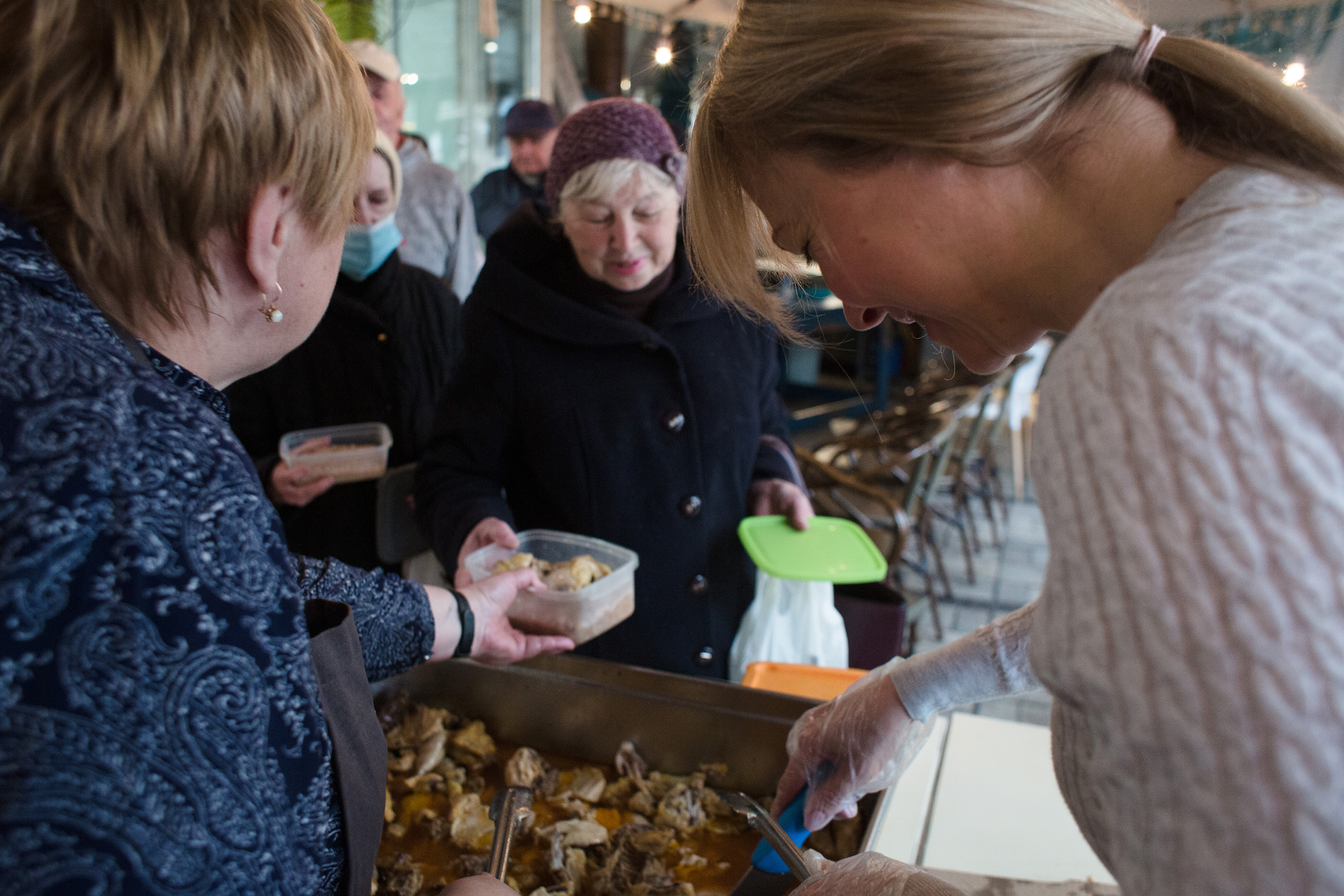 March 29: The volunteers of 'Palianytsia' café serve meals to visitors in Kyiv. The café provides free meals for the elderly.