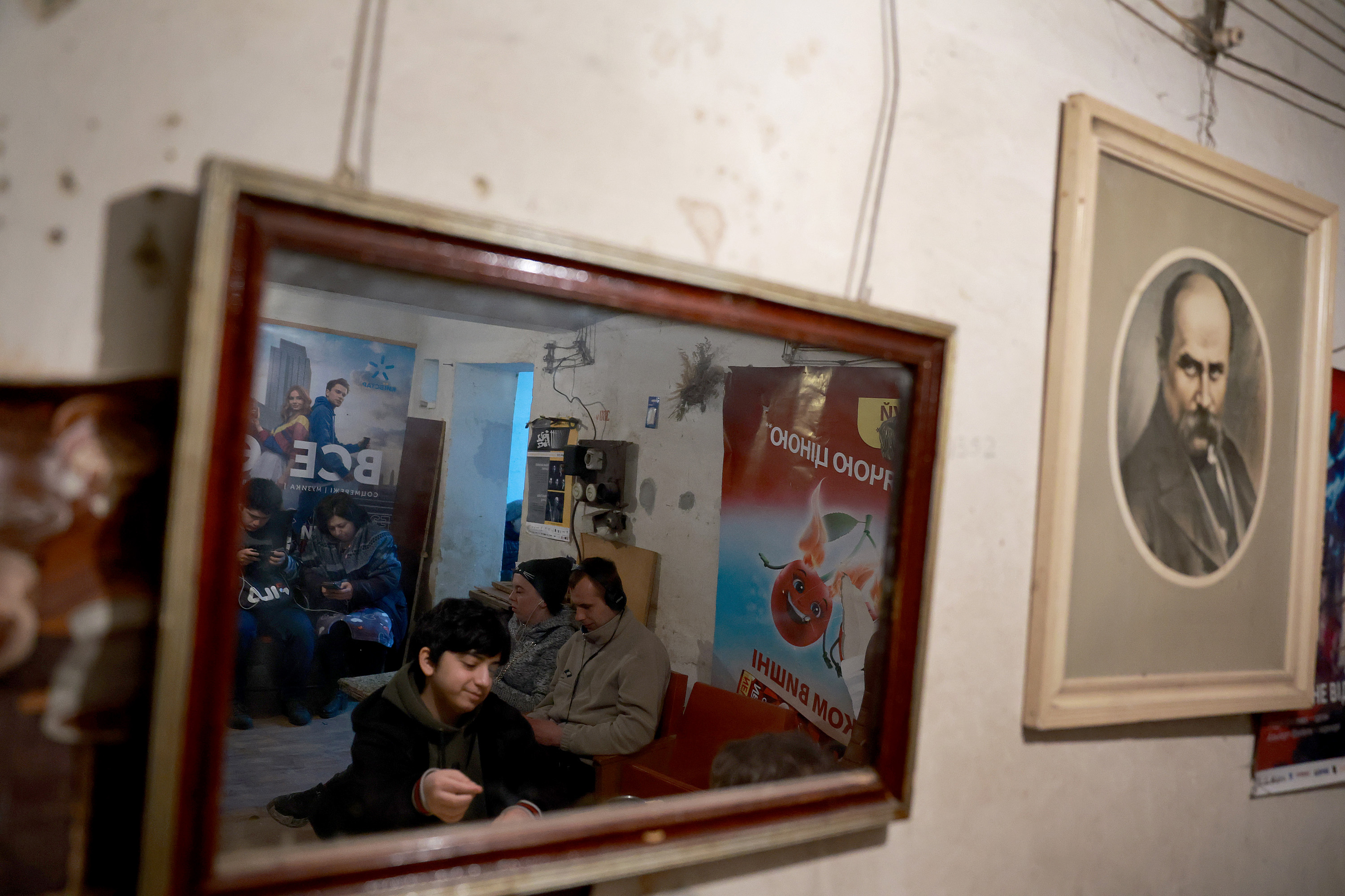 March 29: People sit in a bomb shelter after an air raid siren sounded in Lviv.