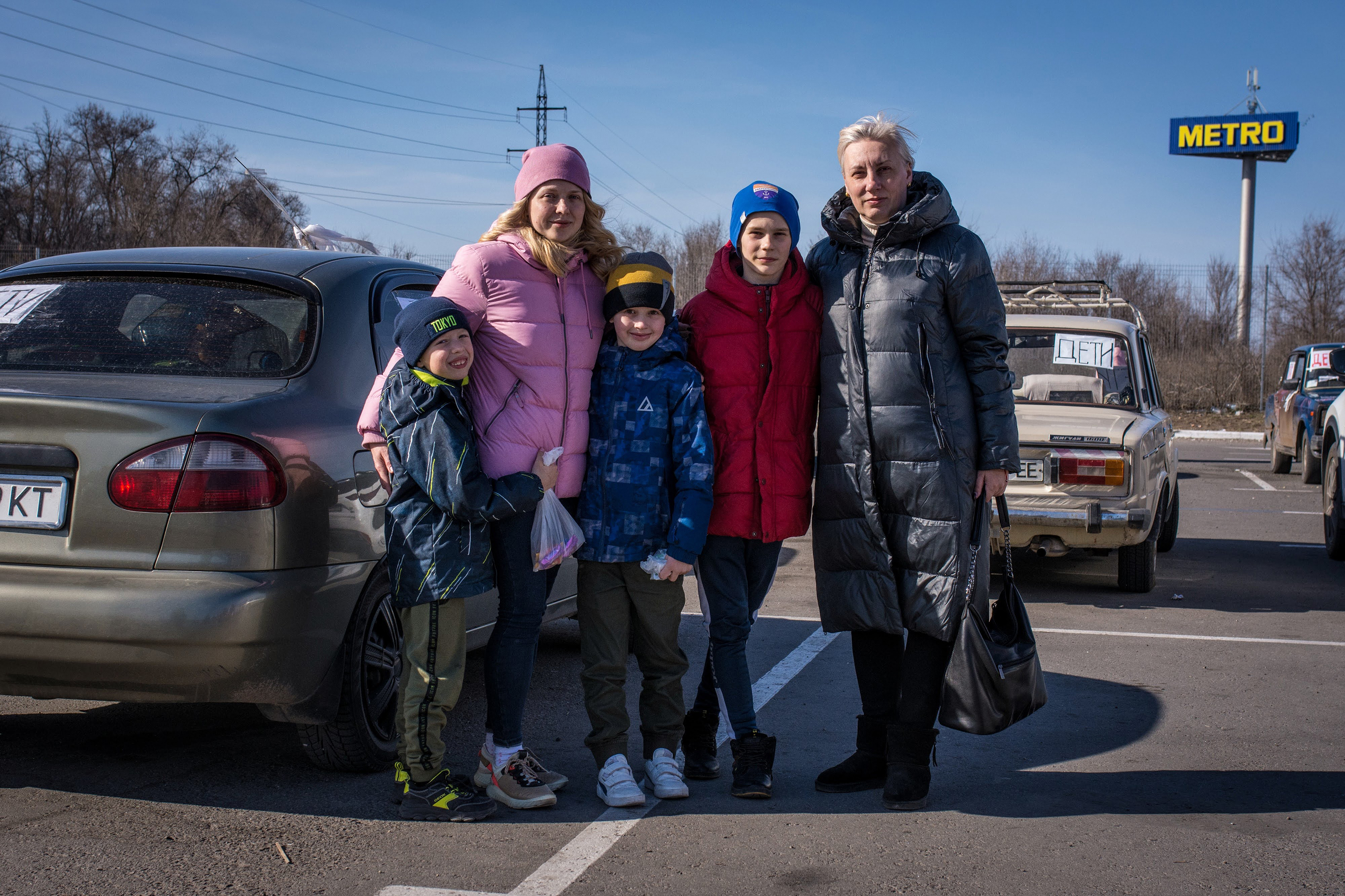 Angelina Voychenko (left) and her children and Yuliya Bortnik (right) and her son fled Mariupol after hiding for weeks in the basement of Voychenko's parents' home, with no electricity, phone service or heat, as the building shook from fighter jets and explosions. When they emerged to buy food, what they saw made them decide to leave: destroyed buildings, looted stores, no food in sight. (NPR)