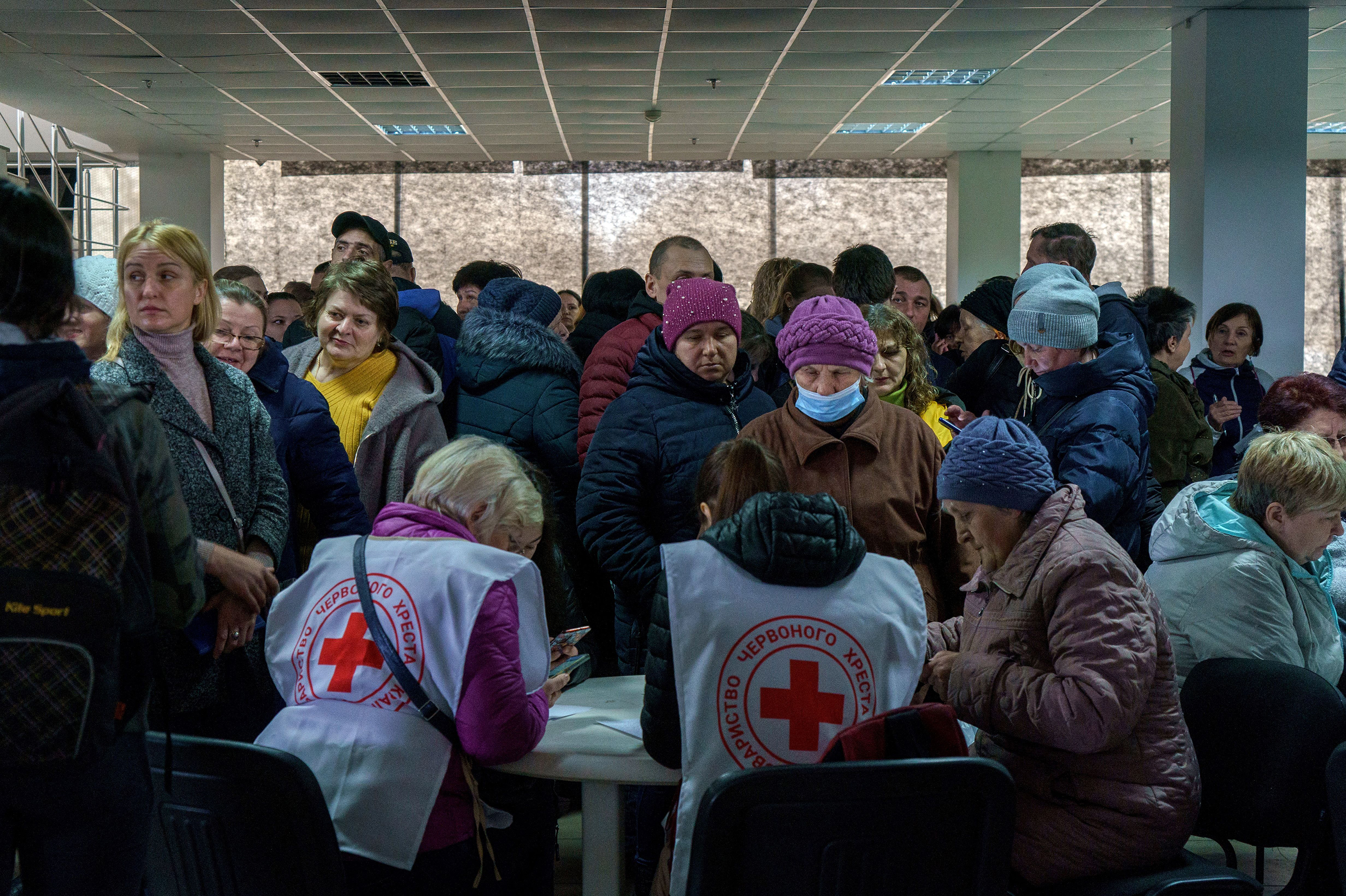March 30: Volunteers help recipients in a Red Cross and local NGO's registration center for Internally Displaced People in Zaporizhzhia. The center helps people who managed to escape the war in eastern Ukraine with money, food and other supplies.