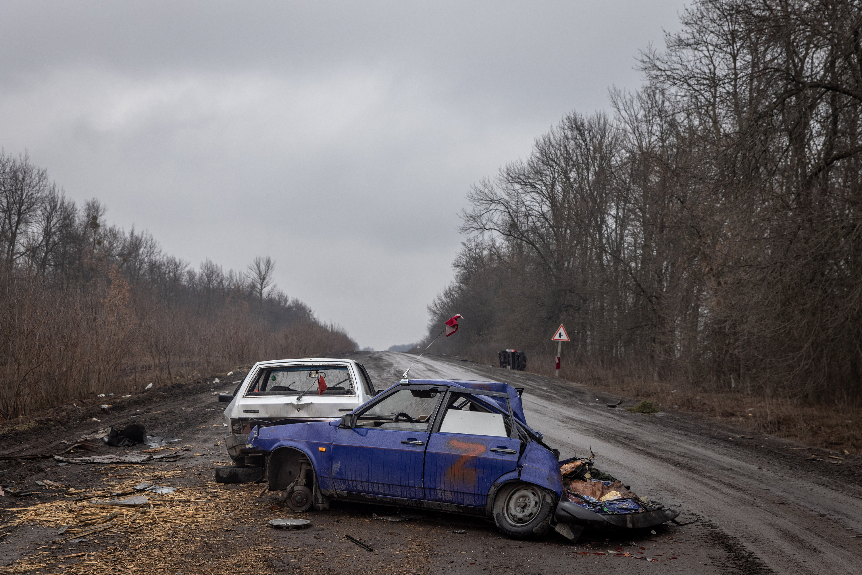 March 30: Cars marked with a "Z" used by Russian military are seen destroyed on a road on the outskirts of Trostyanets.