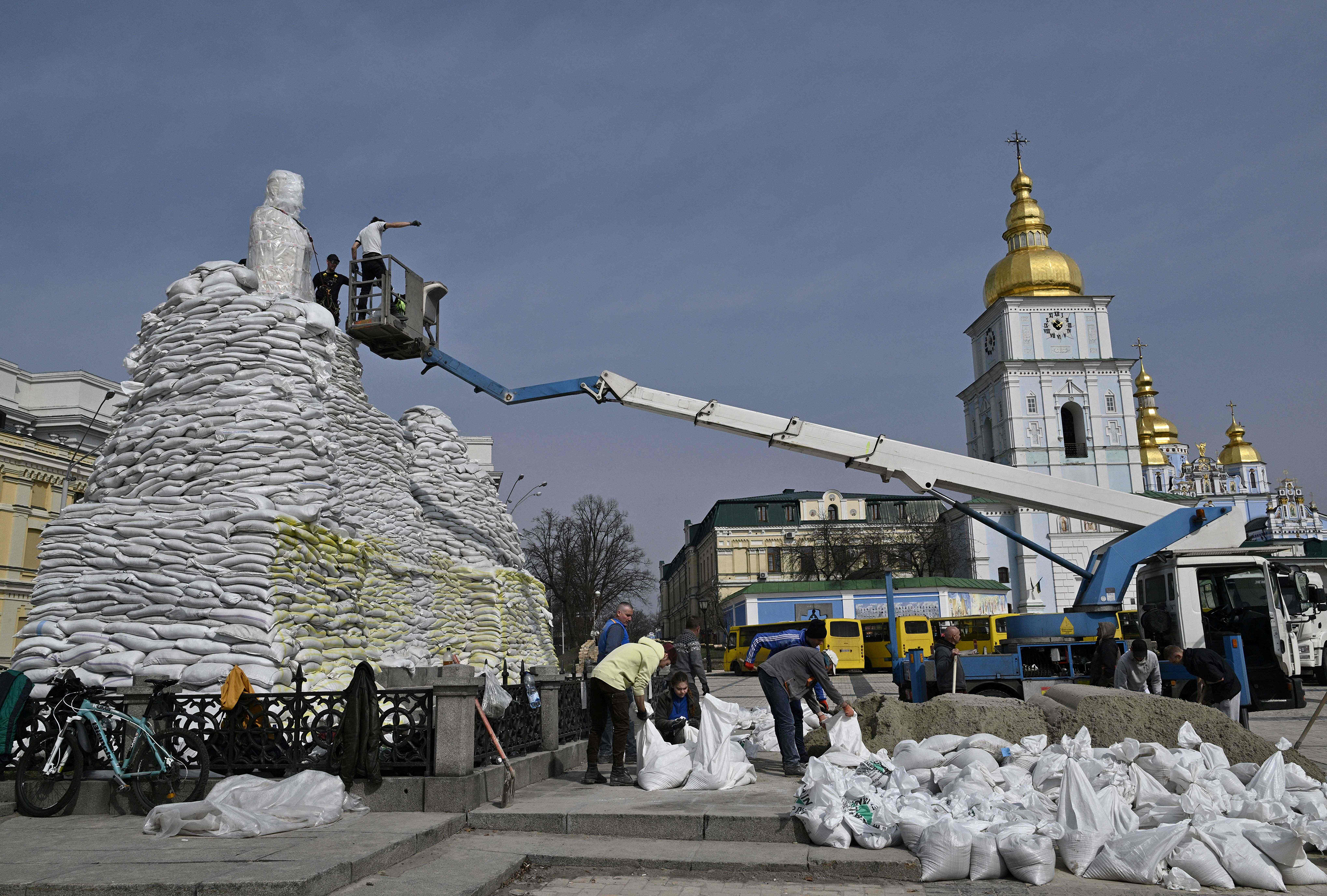 March 31: Volunteers assemble sand bags to cover and protect the Monument to Princess Olga, St. Andrew the Apostle and the educators Cyril and Methodius in Kyiv, amid Russian invasion of Ukraine.