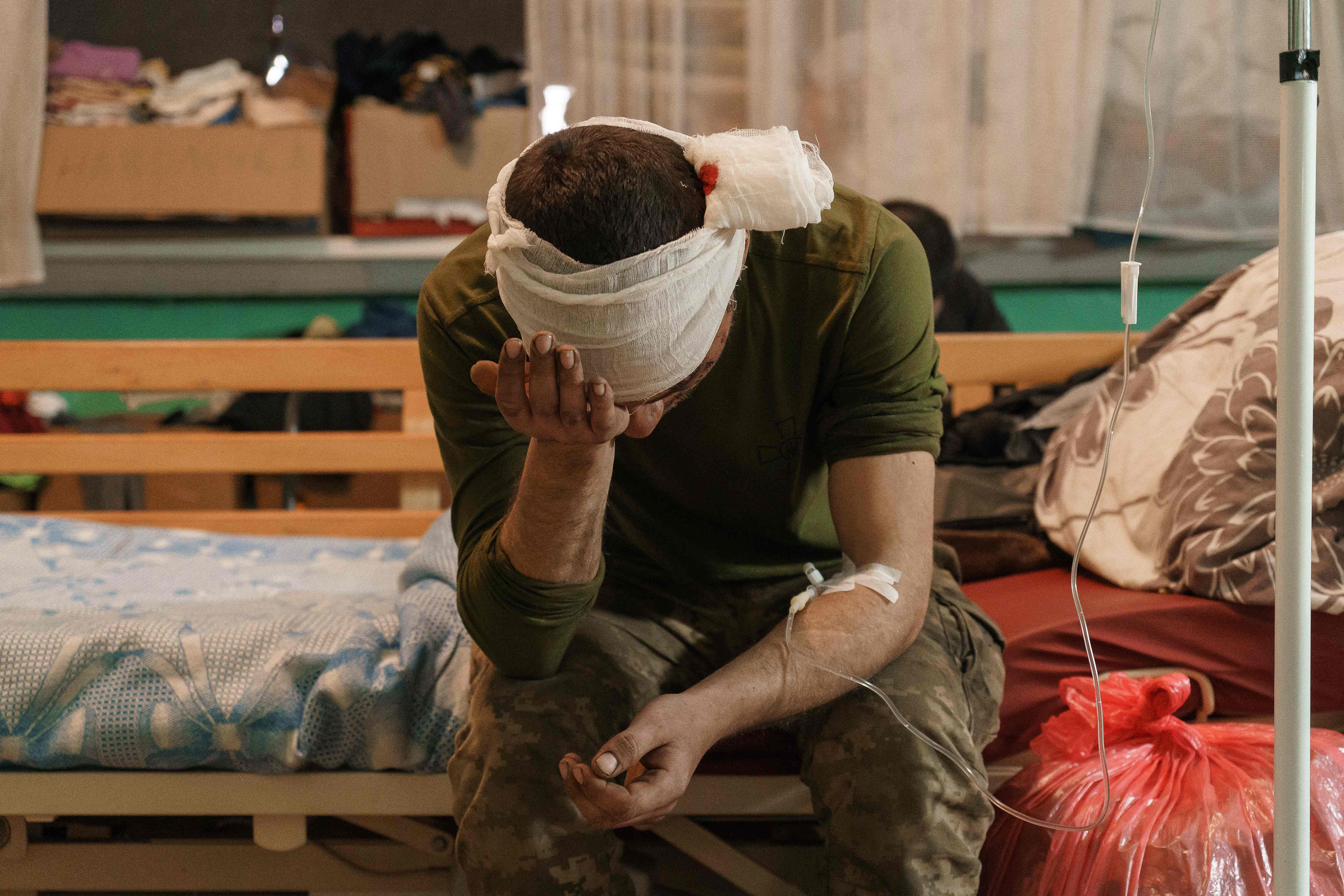 March 31: A newly arrived wounded soldier waits for treatment in a room of the military hospital in Zaporizhzhya, amid Russian invasion of Ukraine.