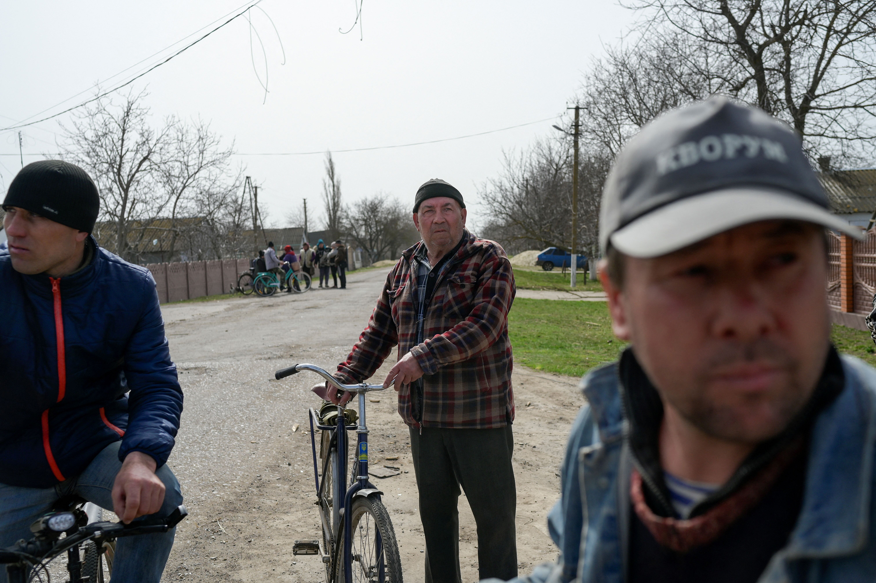 April 1: People gather in the deserted southern Ukraine village of Zelenyi Hai between Kherson and Mykolaiv, less than 5km from the front line, as NATO says it is not seeing a pull-back of Russian forces in Ukraine and expects "additional offensive actions", alliance chief warns.