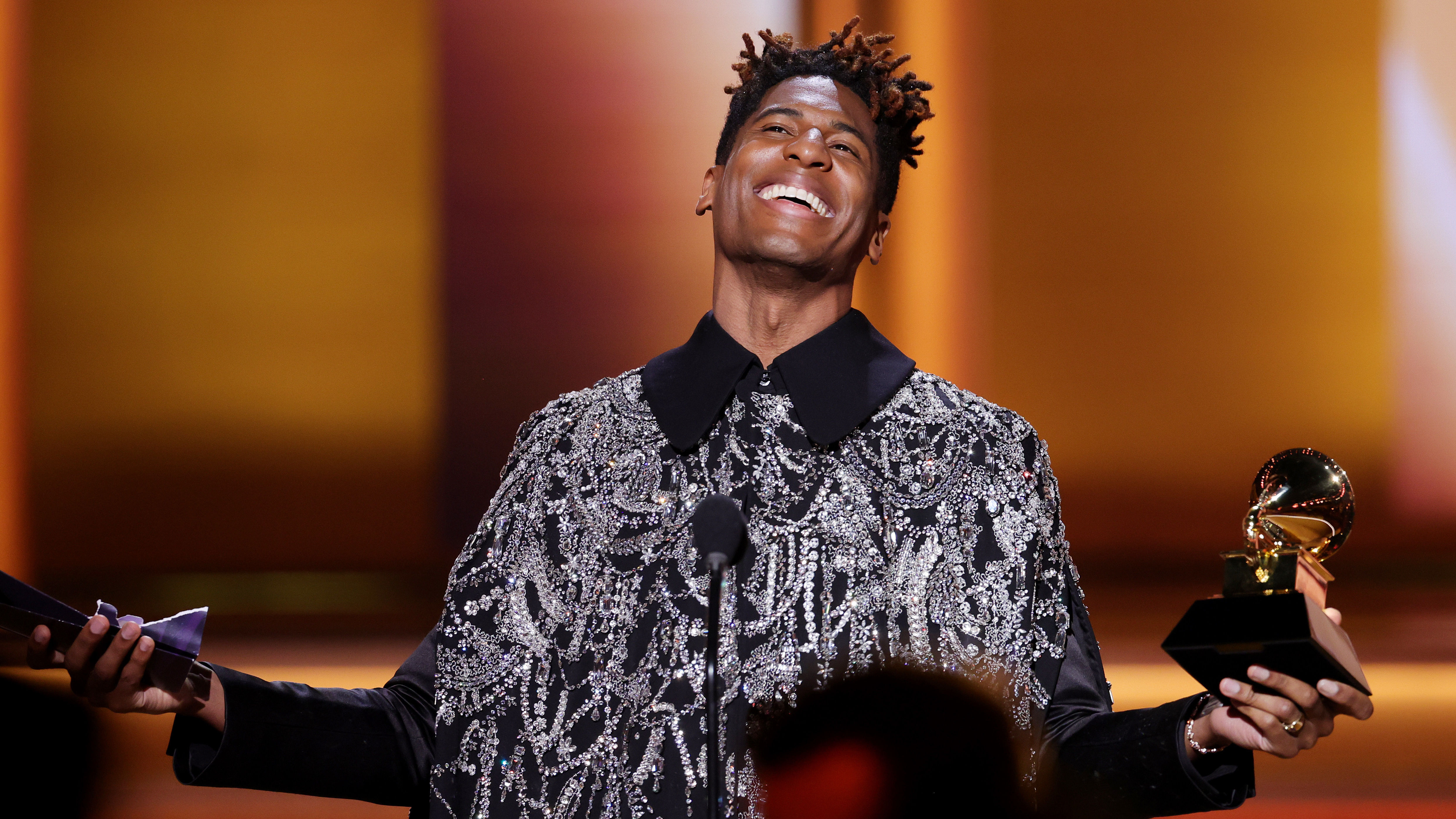 Jon Batiste accepts the Grammy for album of the year at the 64th annual Grammy Awards, presented Sunday, April 3 in Las Vegas. Batiste was the night's biggest winner by the numbers, with five awards including the night's final honor. (Getty Images for The Recording Academy)