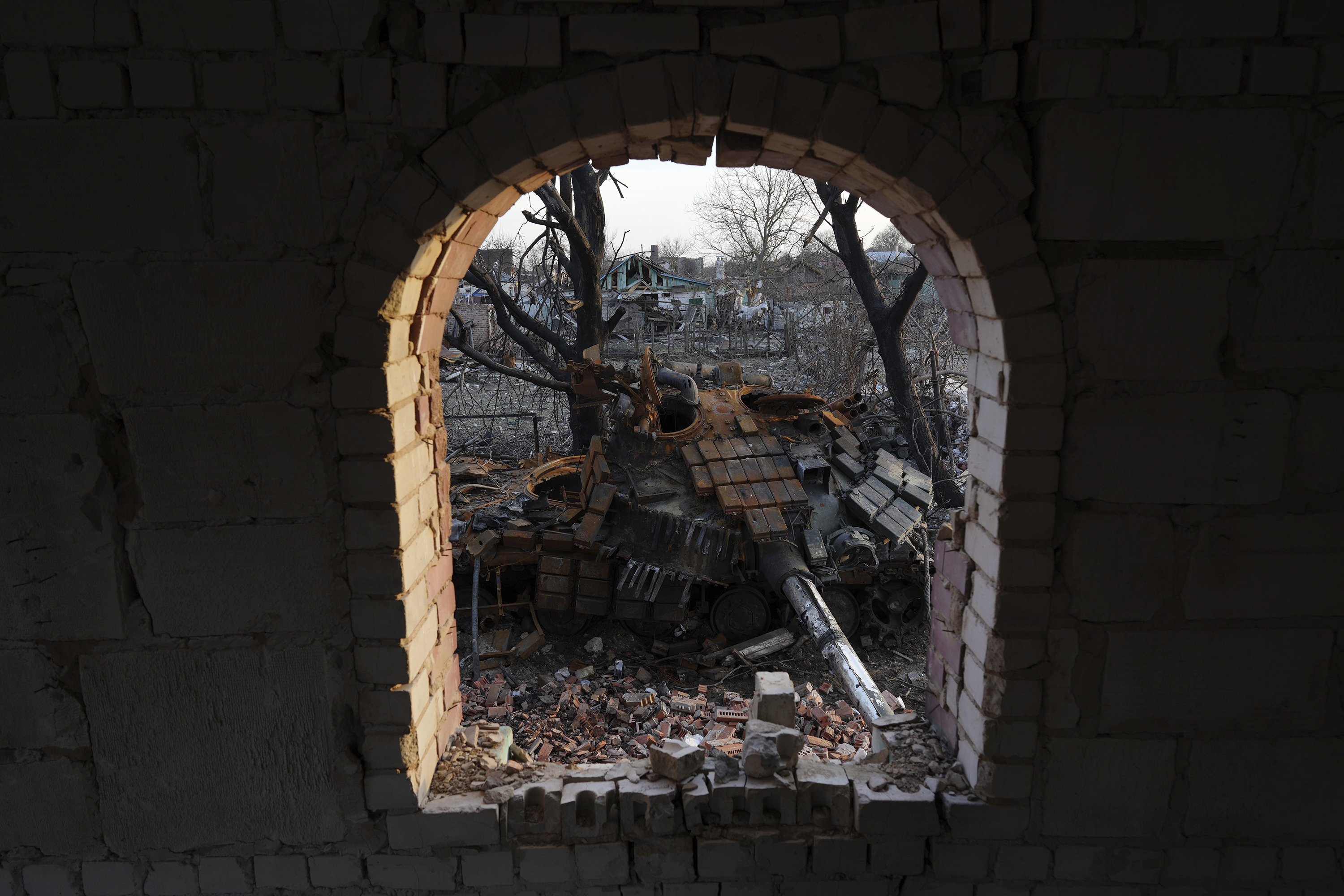 April 7: A destroyed tank sits in a yard in Chernihiv, in northern Ukraine.