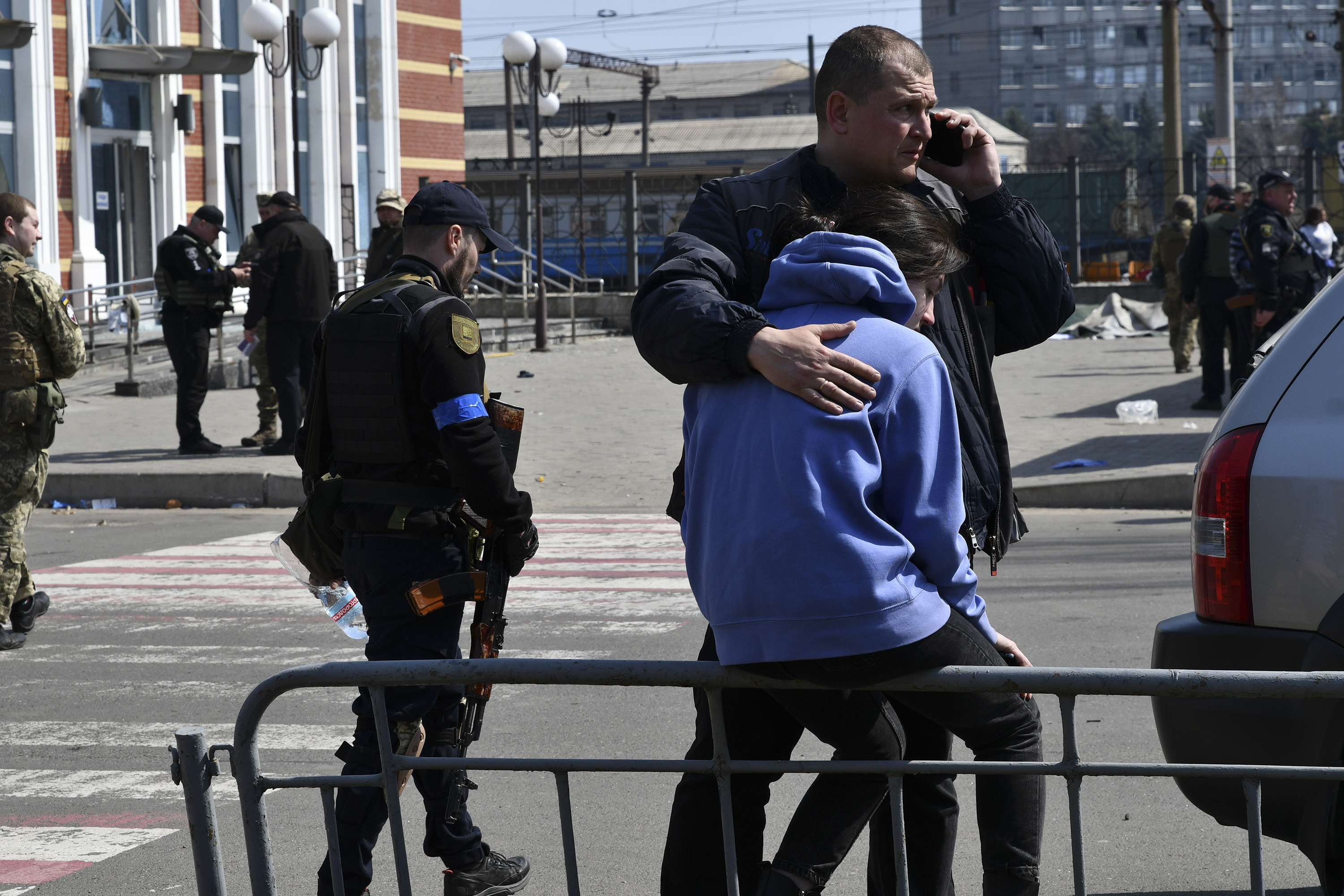 April 8: A man hugs a woman after Russian shelling at the railway station in Kramatorsk.