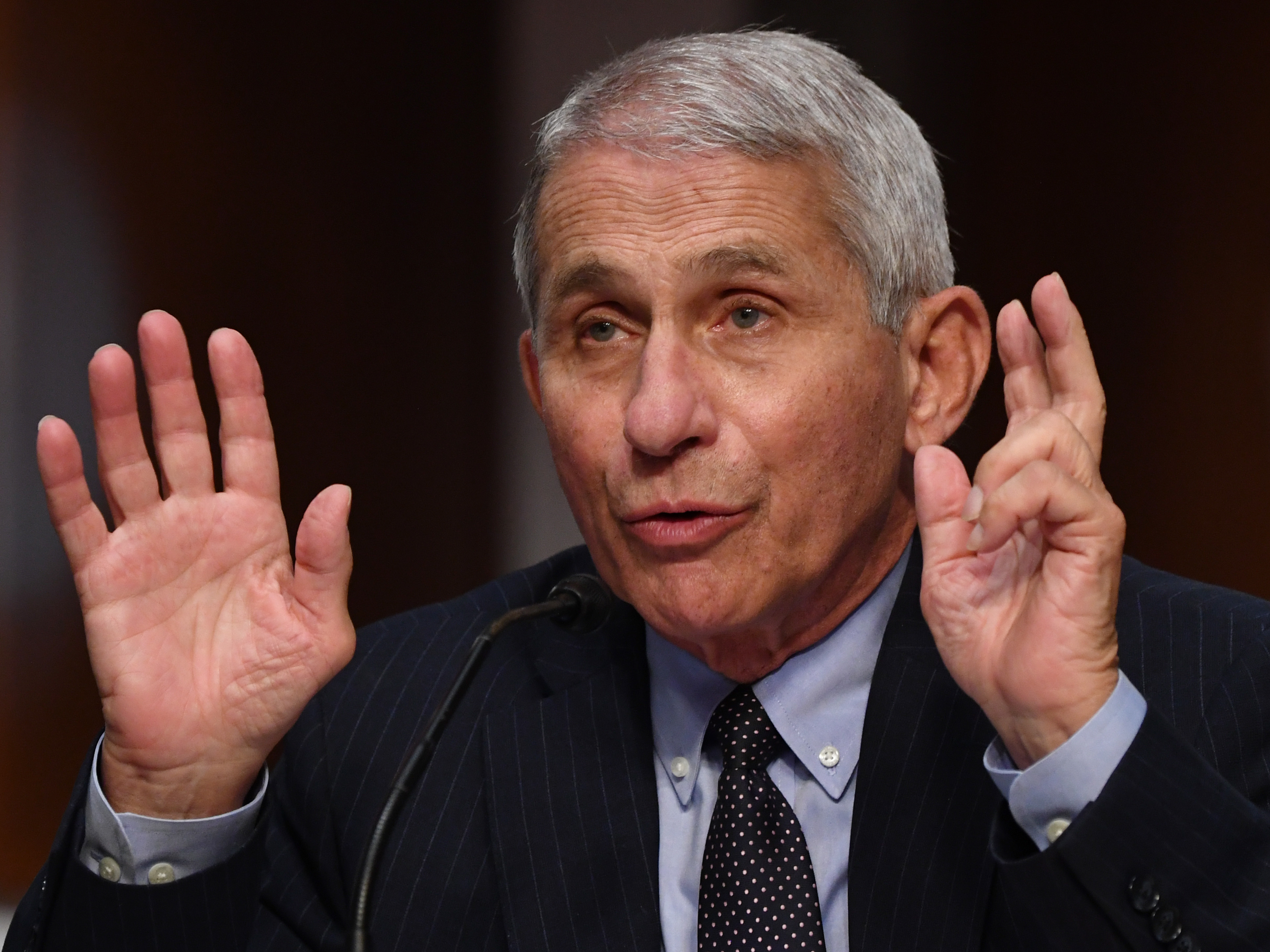 Anthony Fauci predicts that the U.S. will eventually get to the point where COVID-19 vaccines are administered yearly, as the flu vaccine is. (Pool/AFP via Getty Images)
