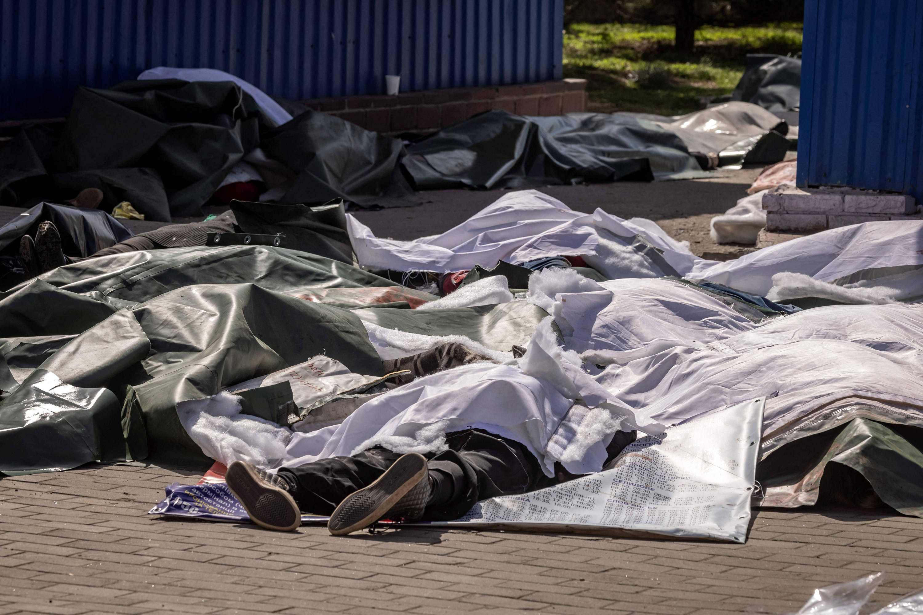 April 8: Bodies are covered in plastic sheets after an explosion killed at least 50 people at a train station in Kramatorsk, in eastern Ukraine. The site was the center of civilian evacuation efforts the government called for ahead of anticipated aggression by Russia in the area.