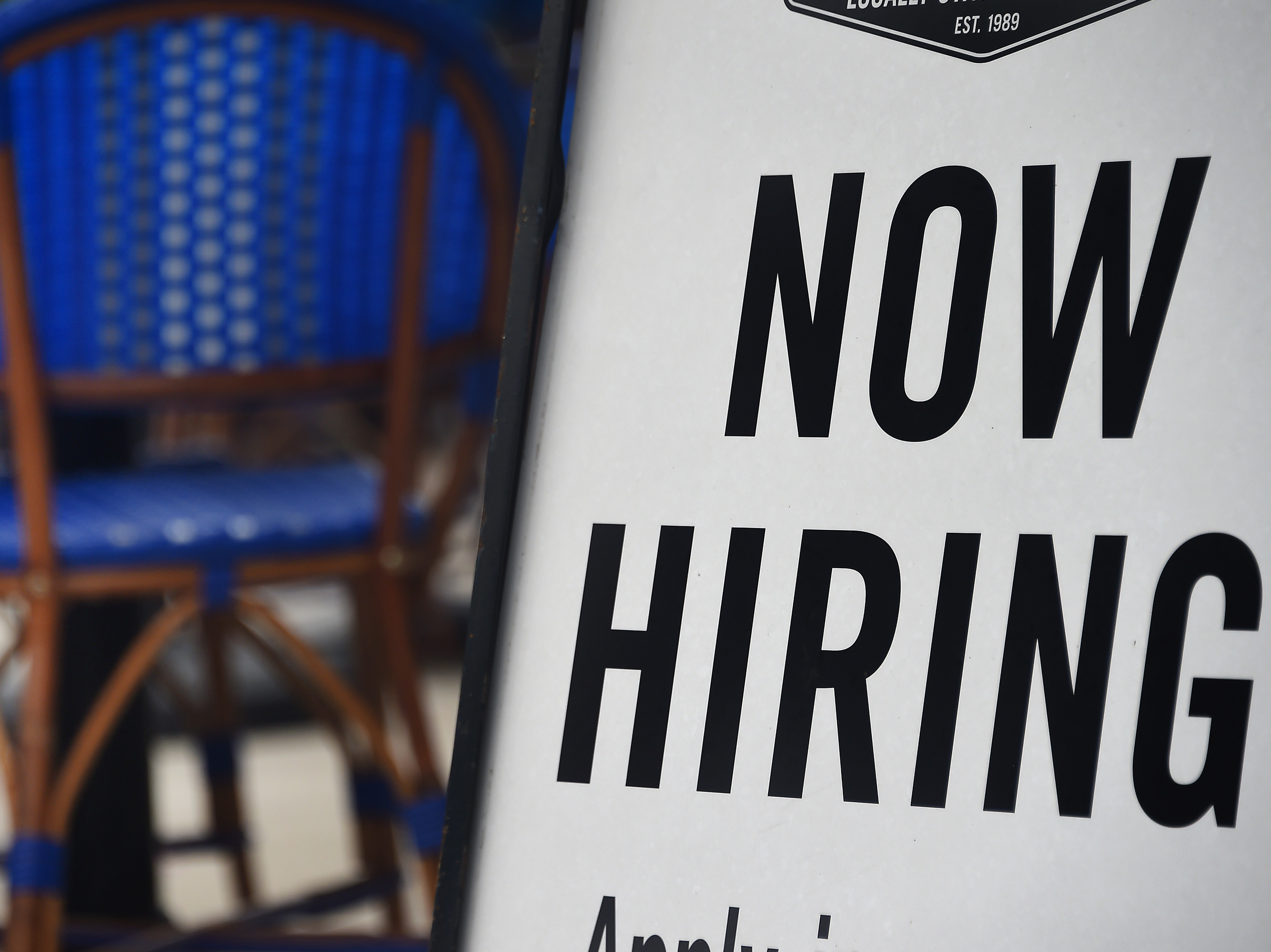 Employers are boosting wages to recruit workers as staffing shortages continue to linger. That's raising the prospect of continued high inflation and aggressive interest rate hikes from the Federal Reserve. (AFP via Getty Images)