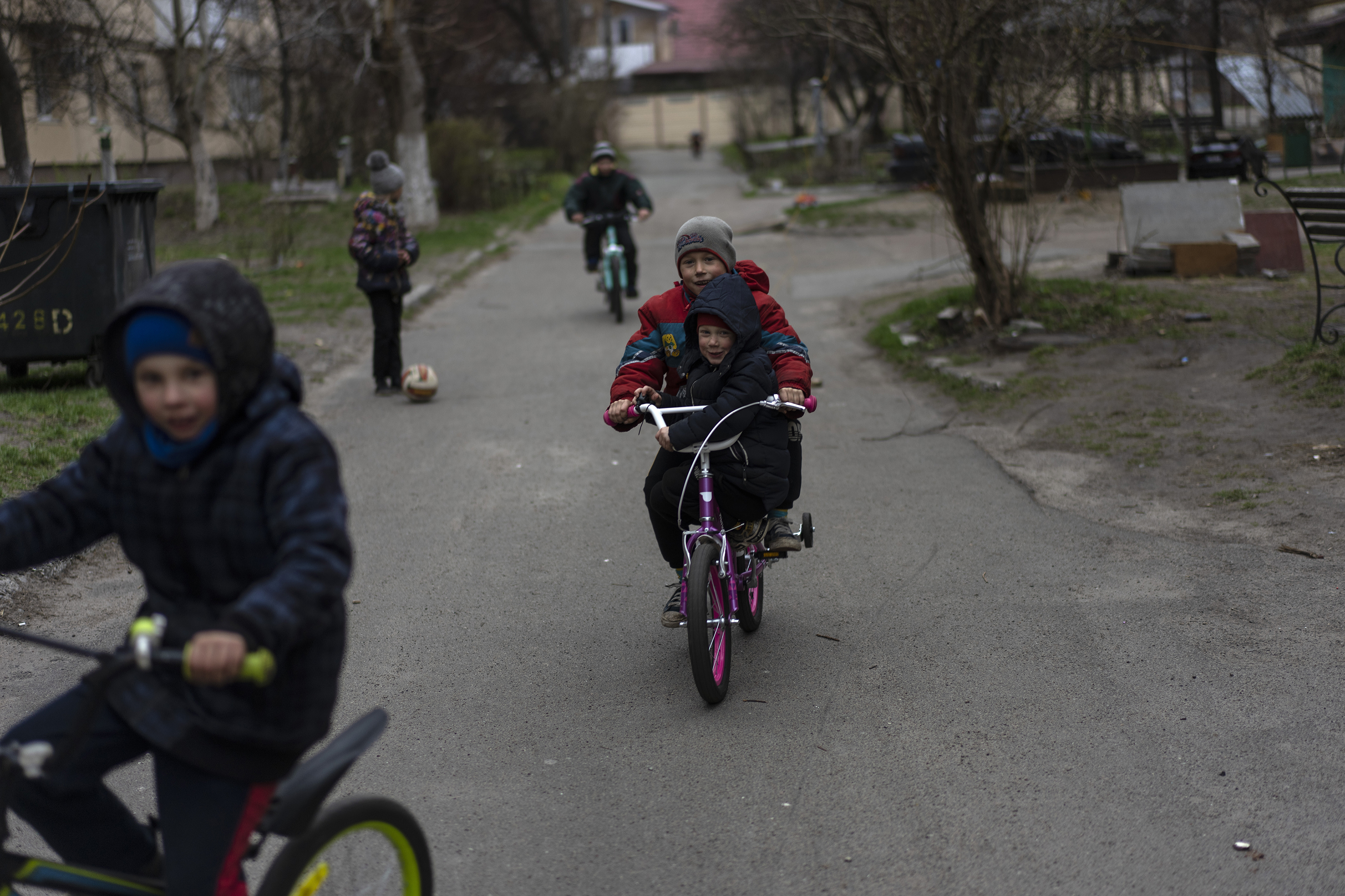 April 13: Children play in Bucha, a suburb of Kyiv.