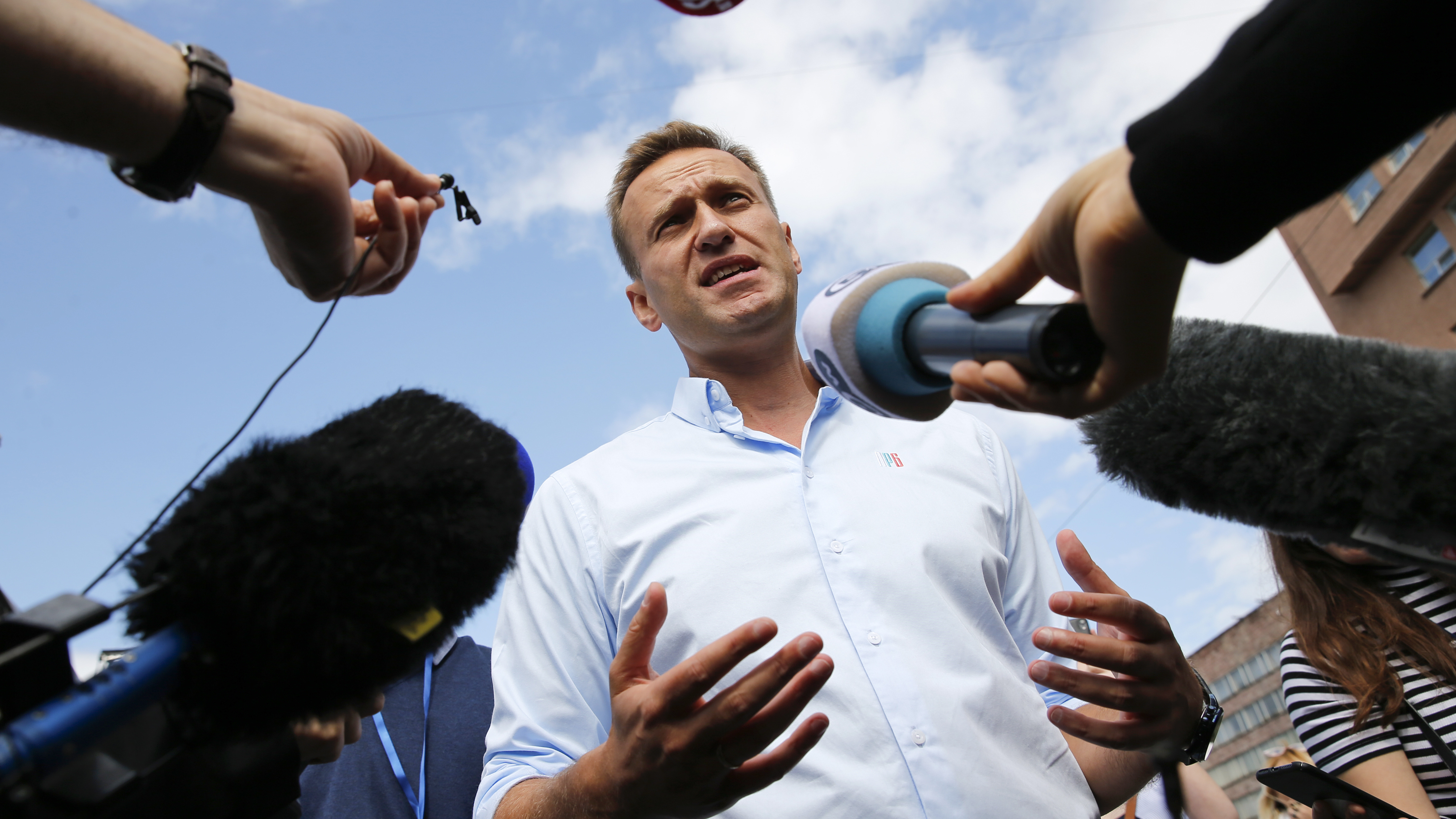 Russian opposition leader Alexei Navalny speaks with journalists during a 2019 rally in Moscow. Navalny premieres April 24 on CNN and CNN+.