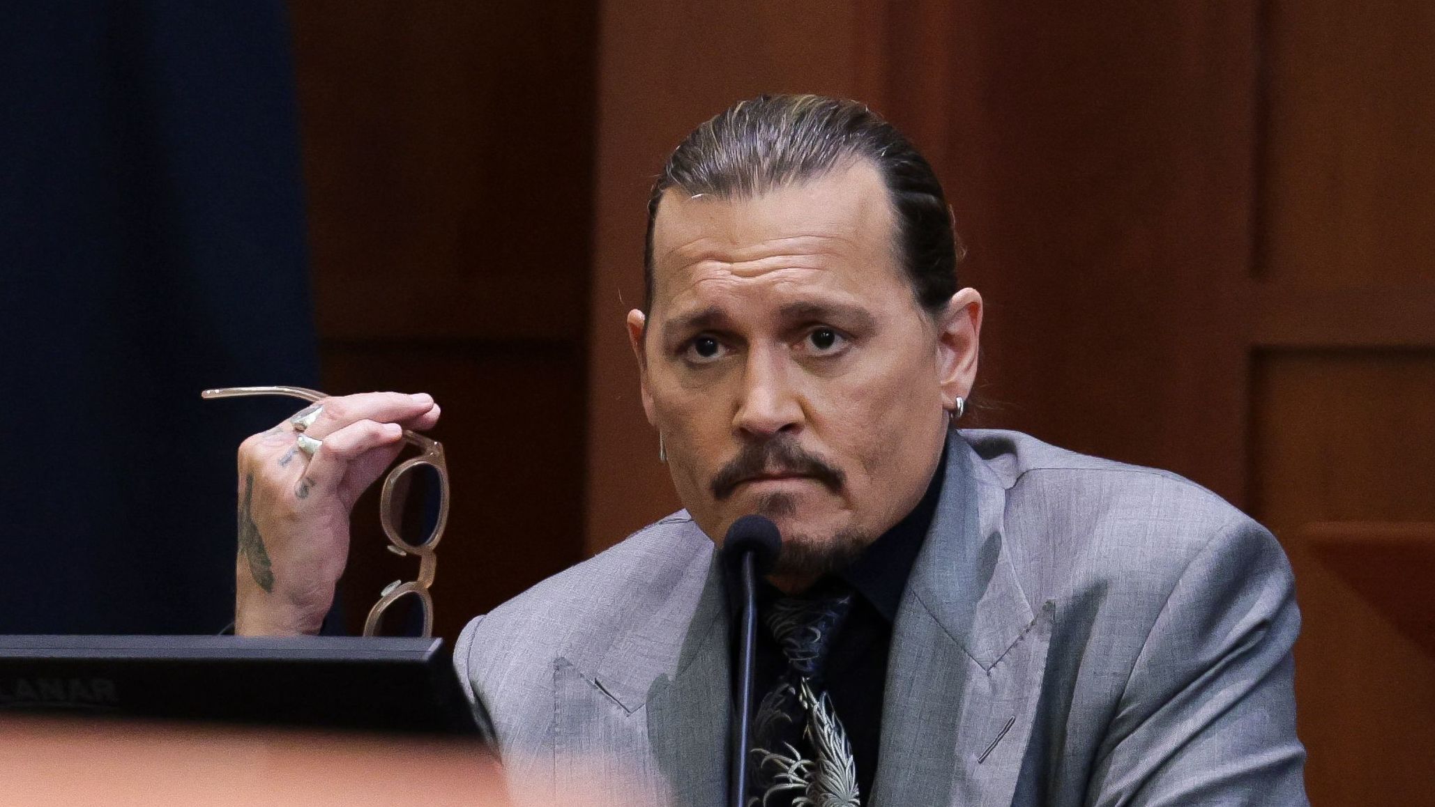 Actor Johnny Depp looks on at the end of the second day of his testimony during the defamation trial against his ex-wife Amber Heard, at the Fairfax County Circuit Courthouse in Fairfax, Va., on Wednesday.