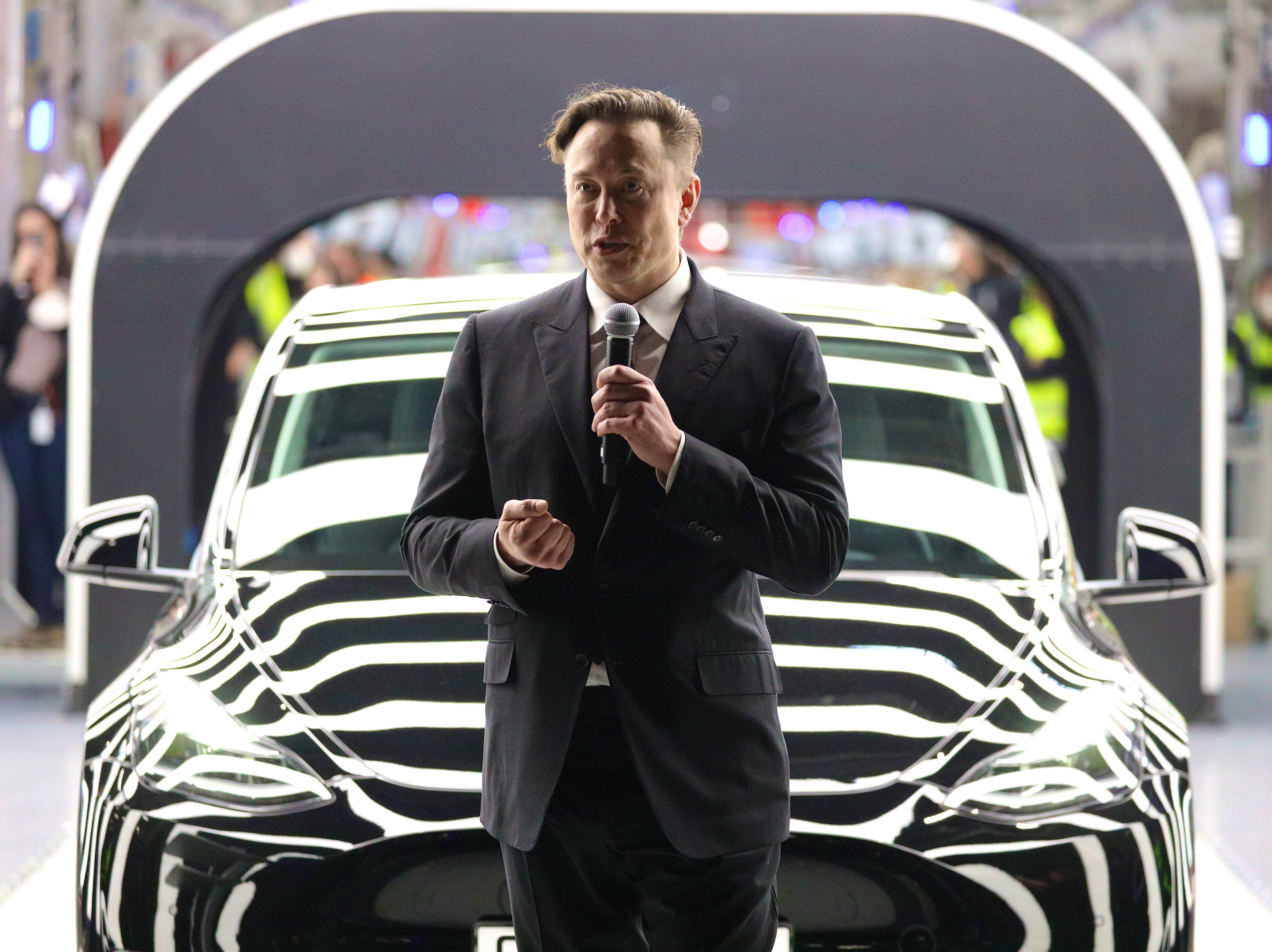 Tesla CEO Elon Musk speaks during the official opening of the new Tesla electric car manufacturing plant near Gruenheide, Germany, on March 22. Tesla shares sank on Tuesday, a day after Twitter accepted a takeover offer from Musk. (Getty Images)